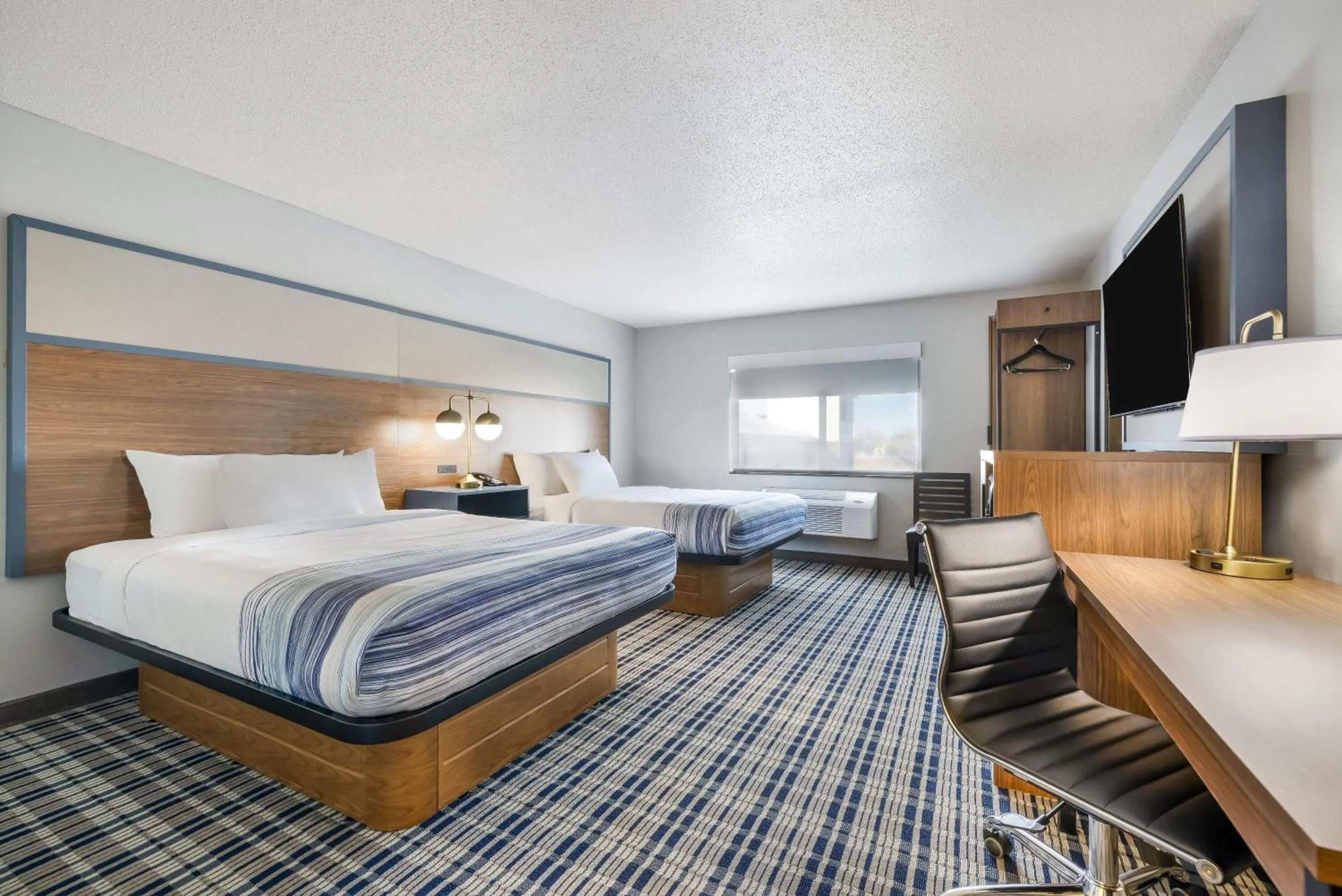 Bed in AmericInn by Wyndham Aberdeen Event Center