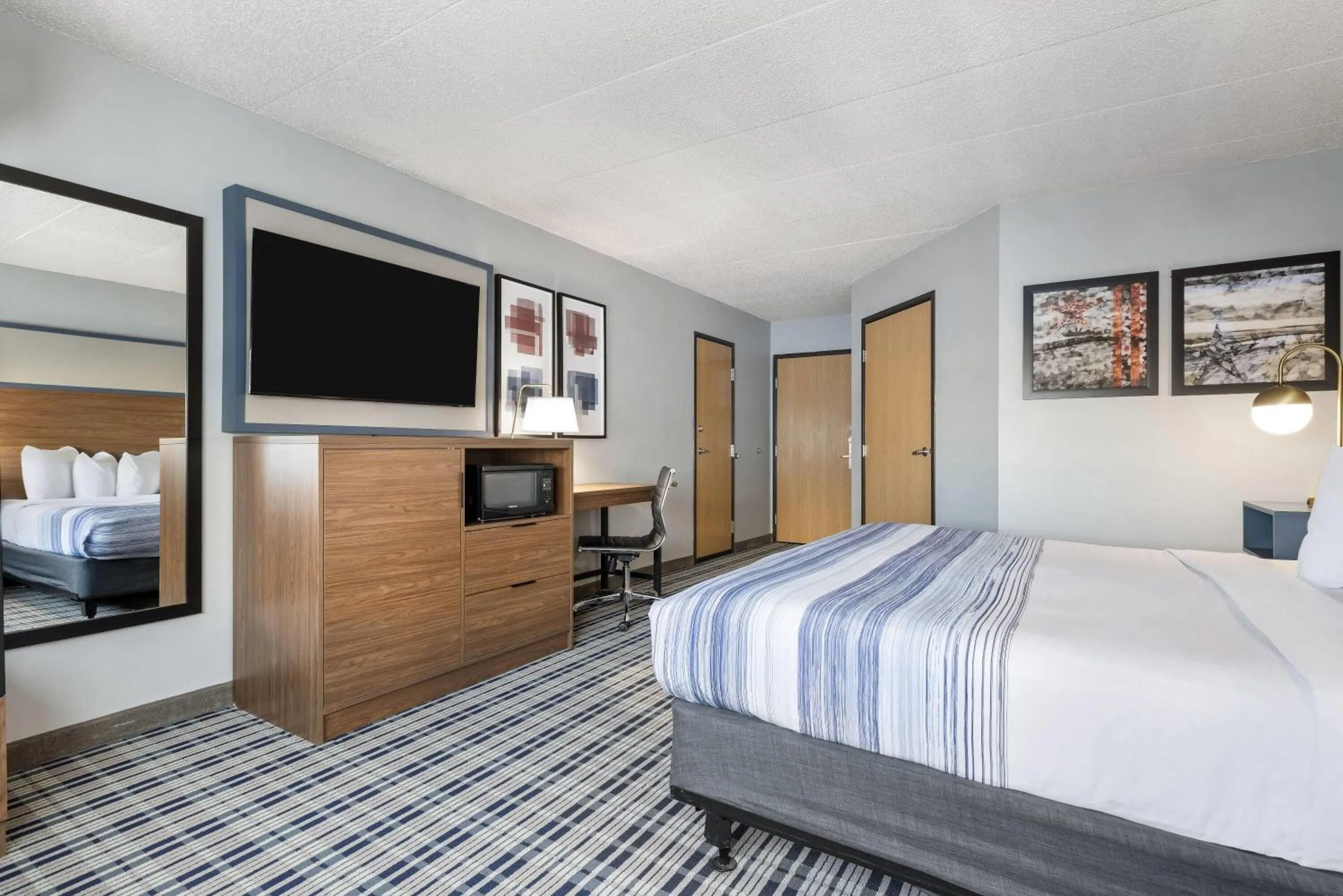 Bed in AmericInn by Wyndham Aberdeen Event Center