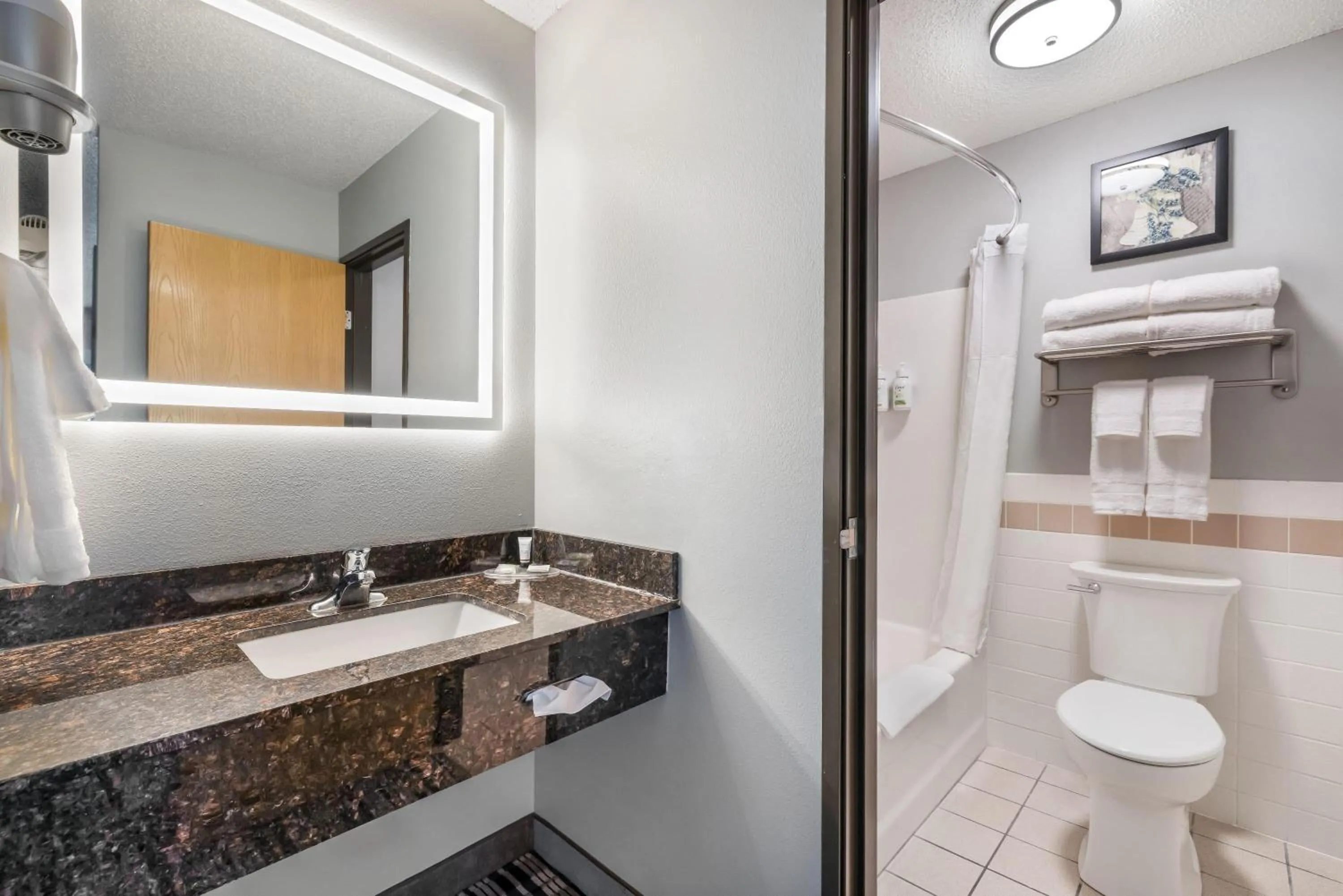 Bathroom in AmericInn by Wyndham Aberdeen Event Center