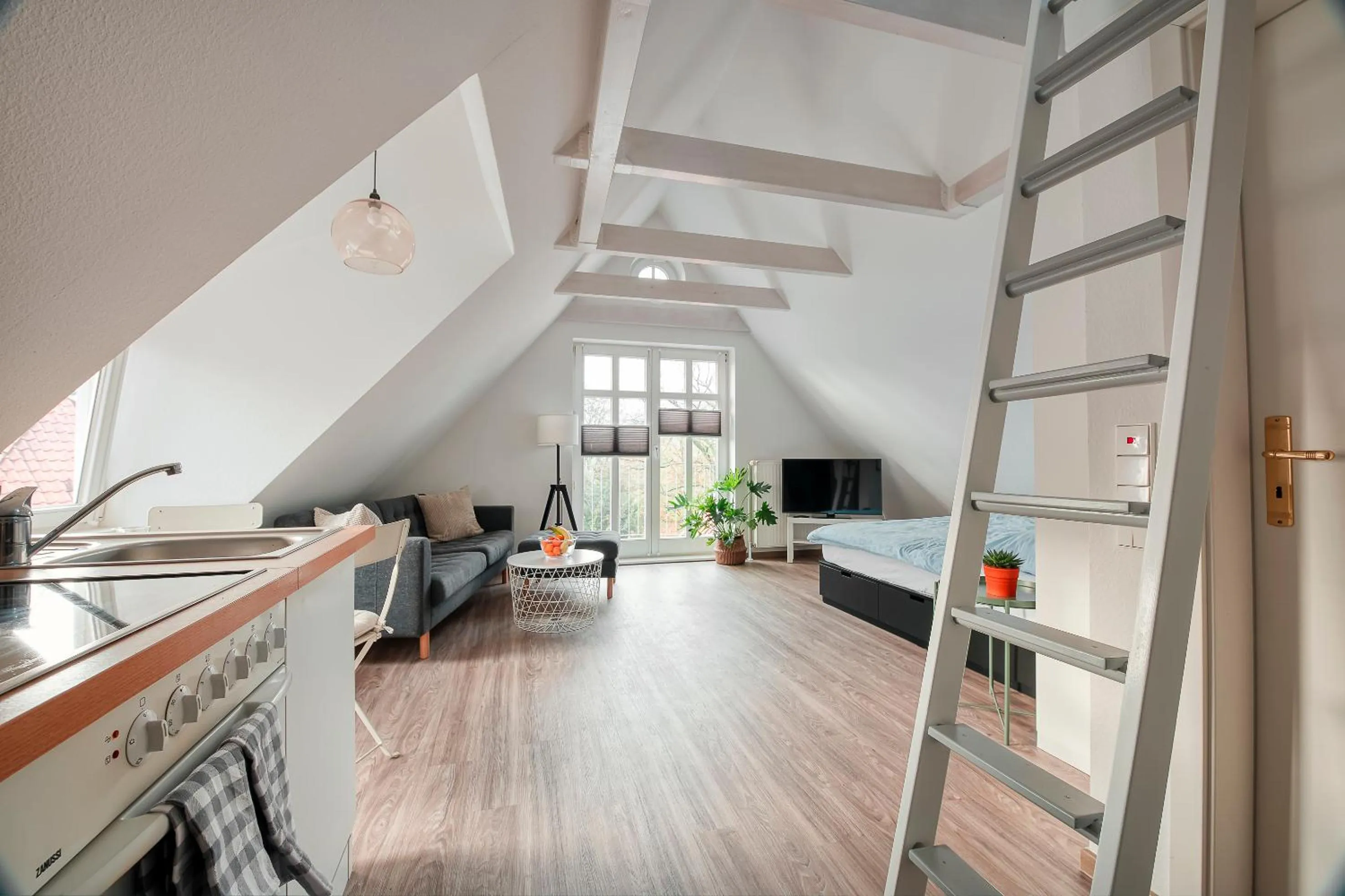 Kitchen or kitchenette, Bed in Altstadt Apartments Verden