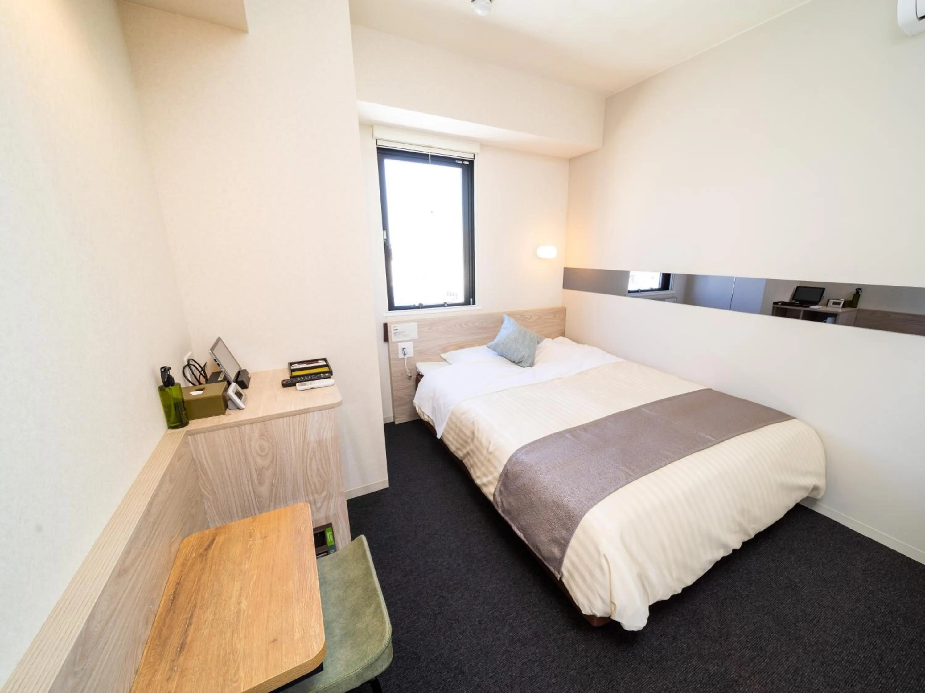 Bed in Super Hotel Premier Akihabara