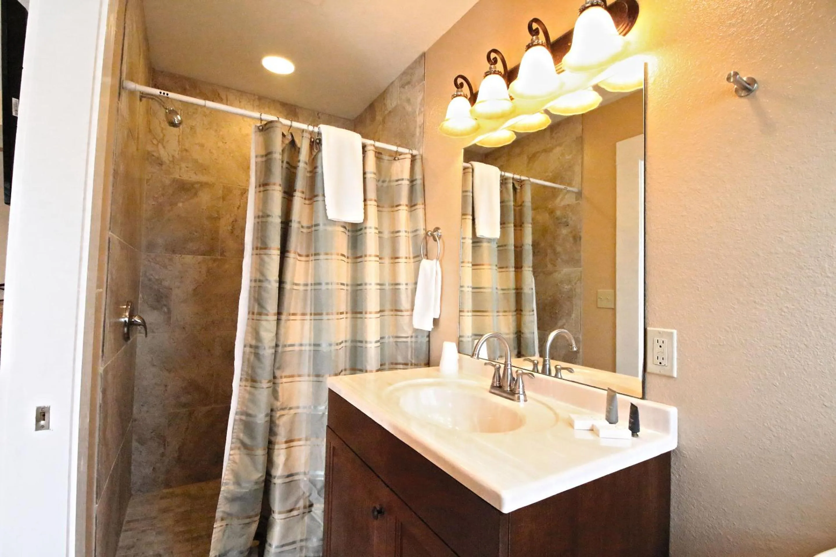 Bathroom in Peach Tree Inn & Suites