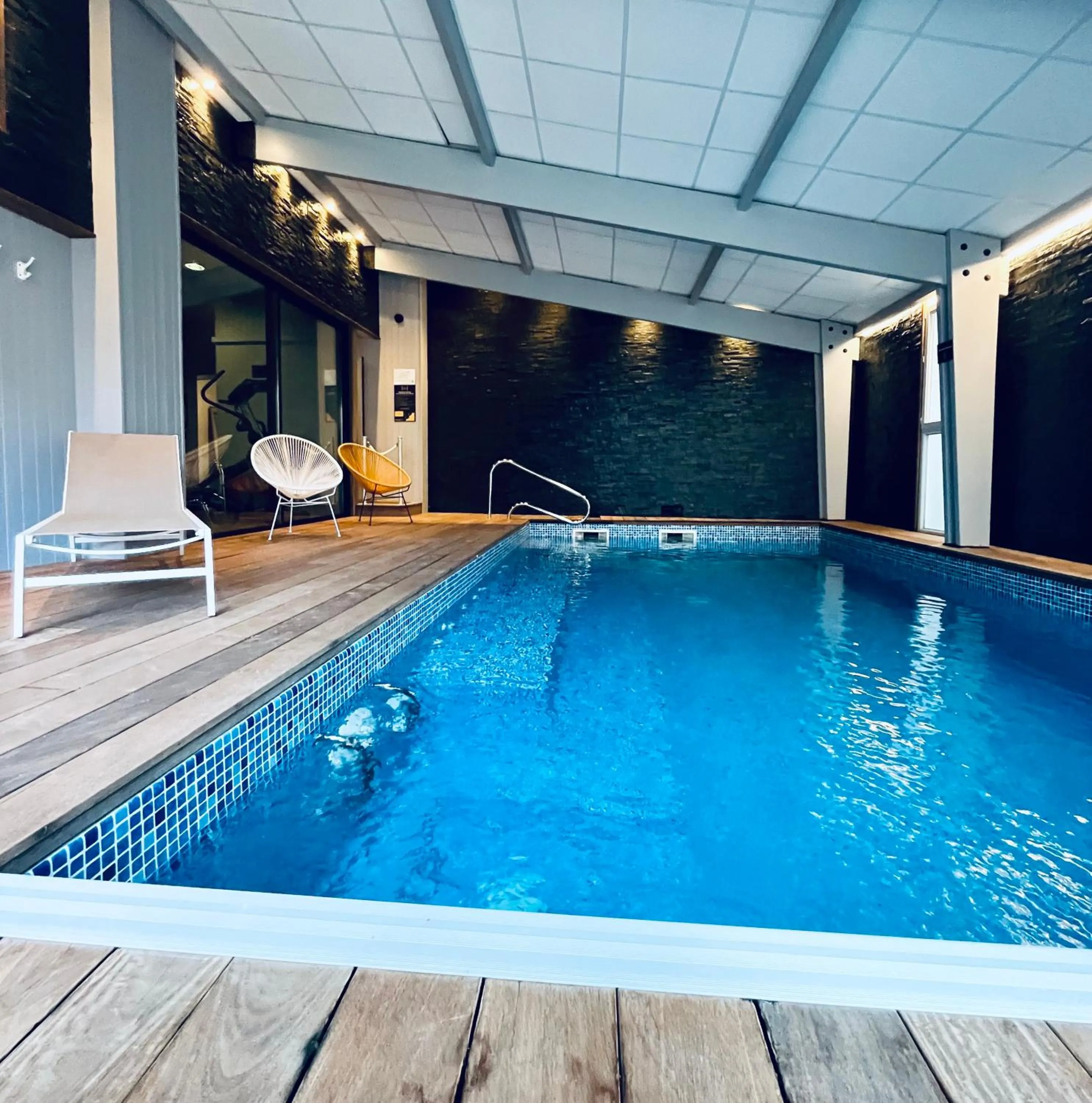 Swimming pool in The Originals Boutique, Grand Hôtel Saint-Pierre, Aurillac