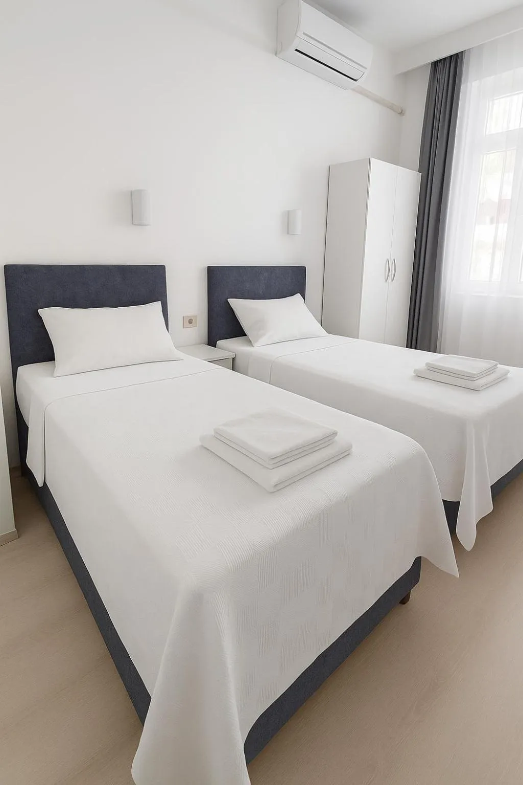 Bed in R HOUSE HOTEL