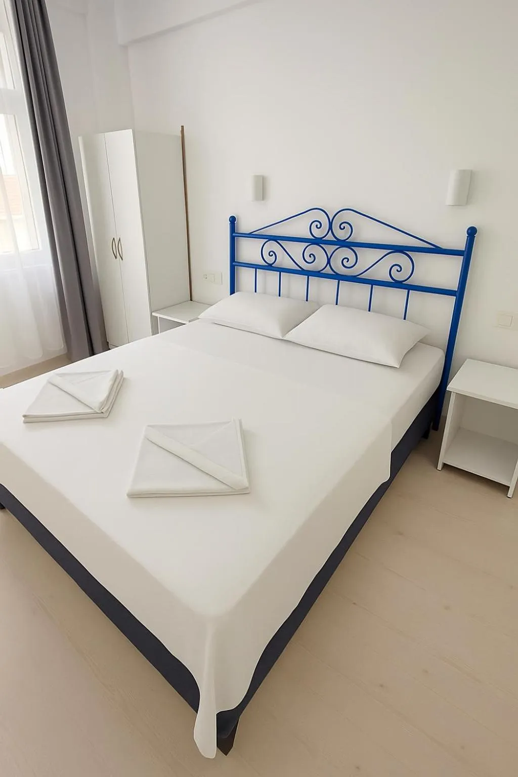 Bed in R HOUSE HOTEL