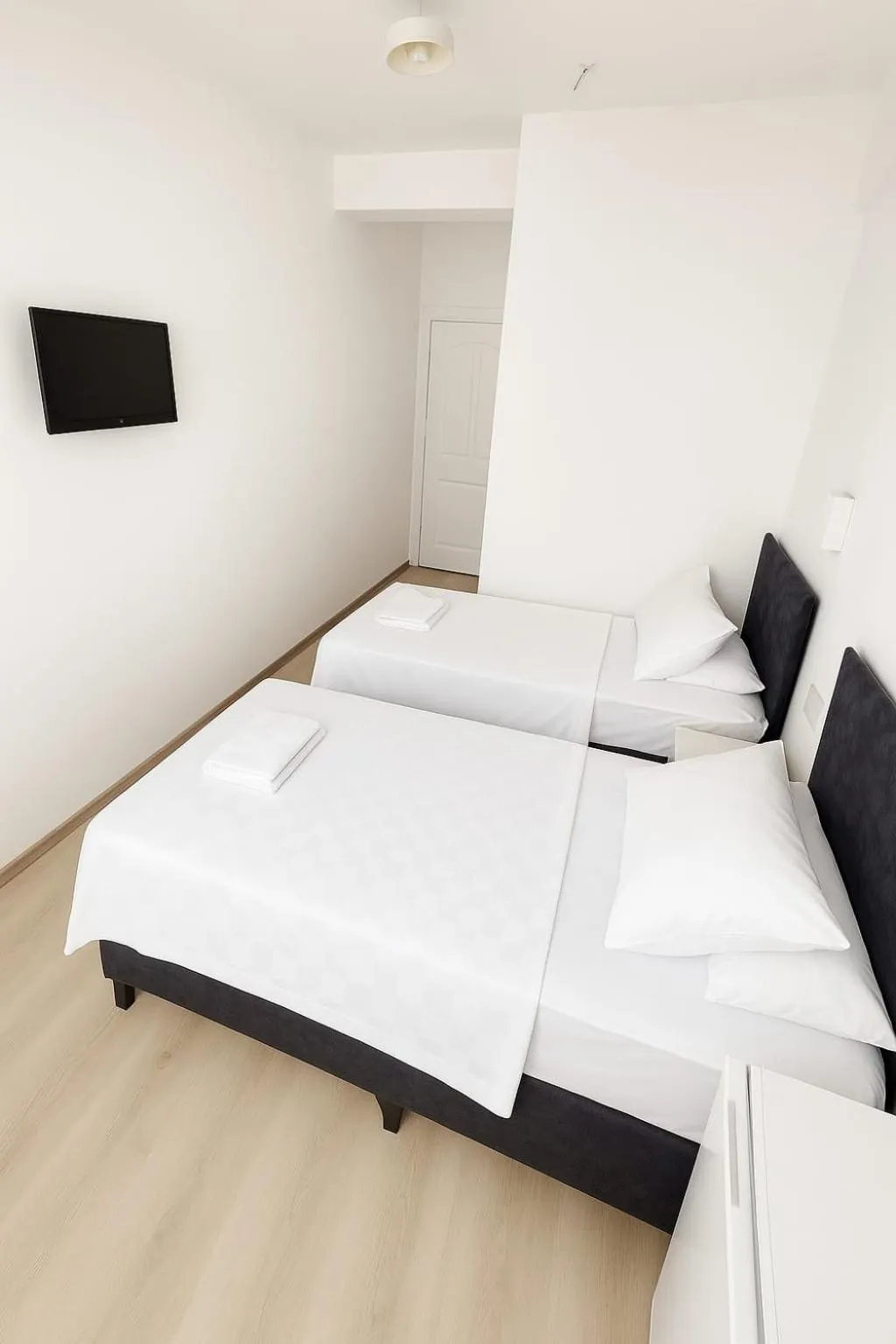 Bed in R HOUSE HOTEL