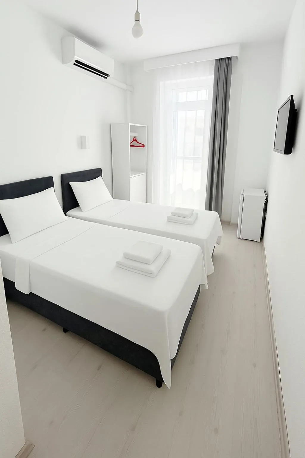 Bed in R HOUSE HOTEL