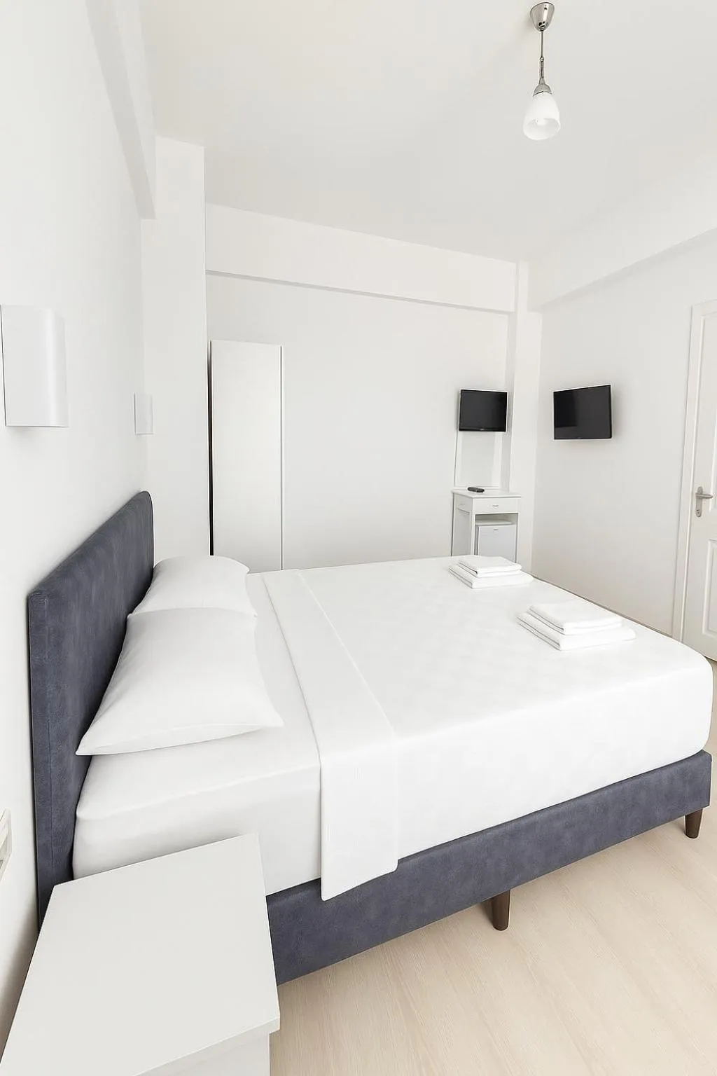 Bed in R HOUSE HOTEL