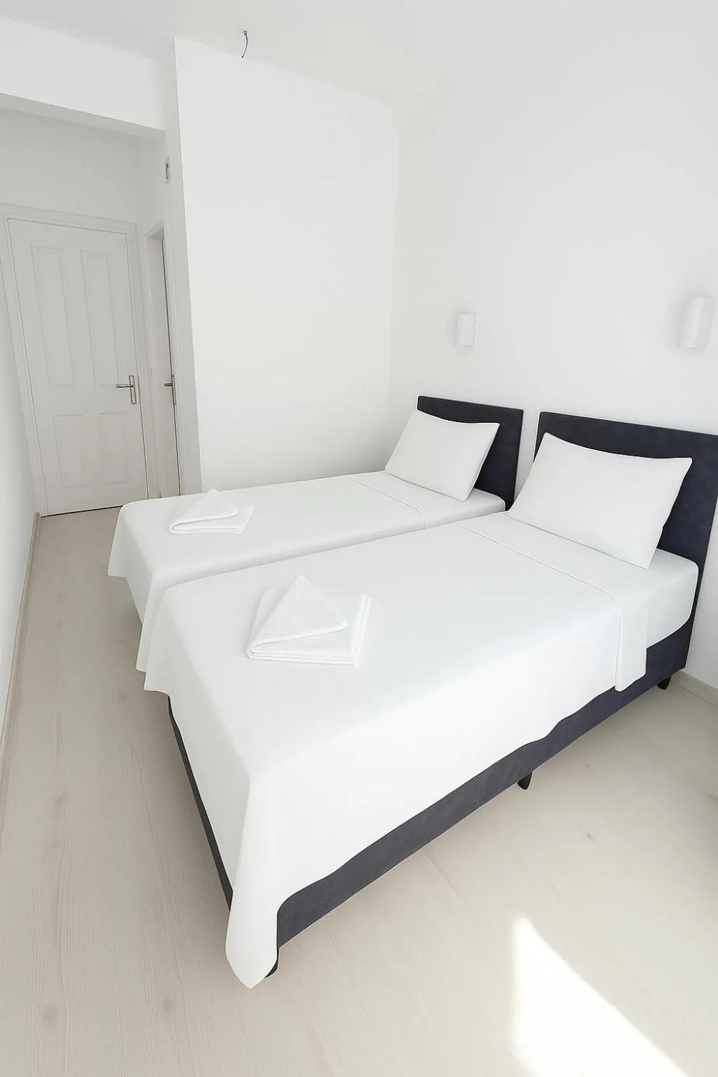 Bed in R HOUSE HOTEL