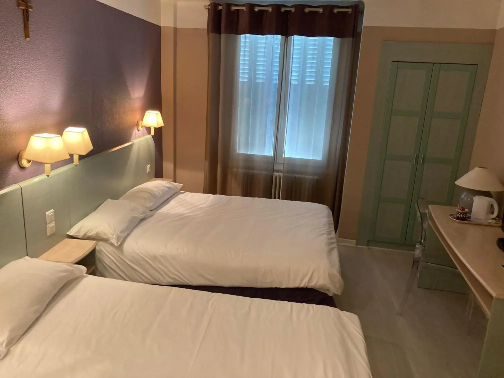 Bed in Hôtel Christina Lourdes Bed in Hôtel Christina Lourdes