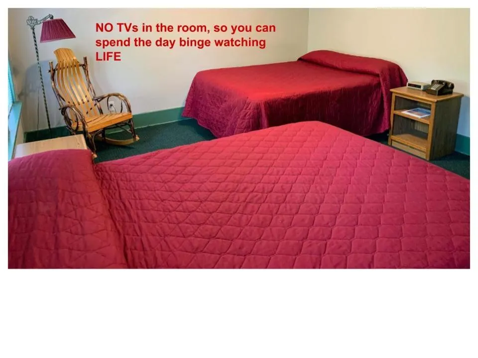 Bed in Gordon Beach Inn