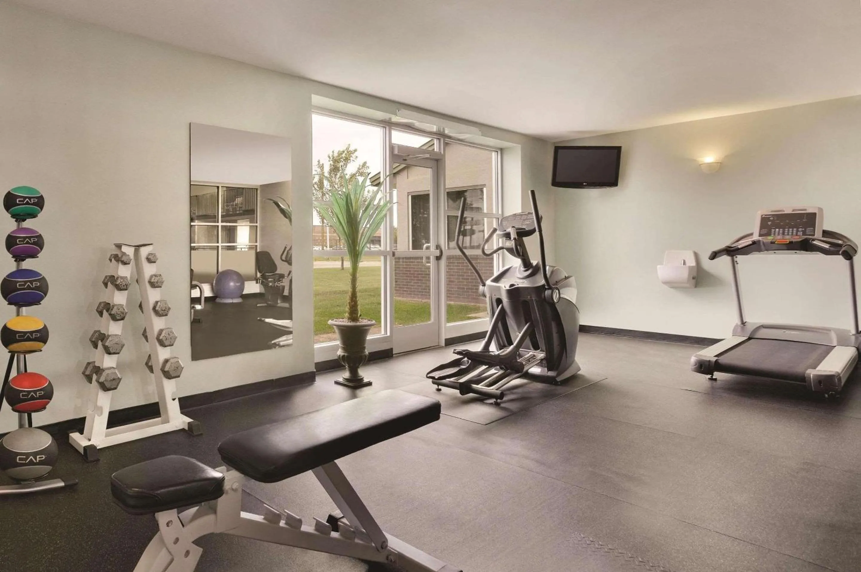 Fitness centre/facilities in Country Inn & Suites by Radisson, Fergus Falls, MN