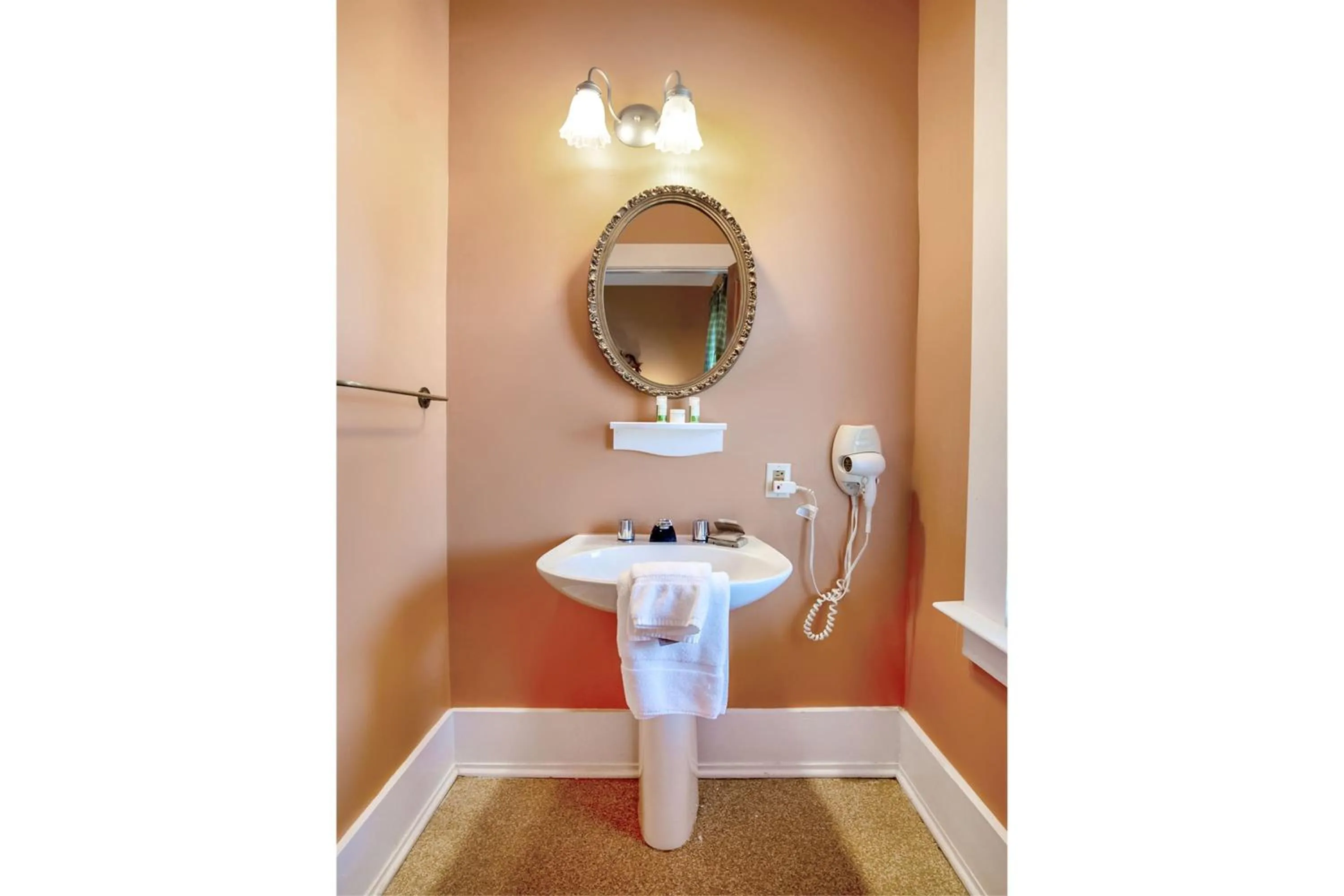 Bathroom in The Belmont Inn by OYO