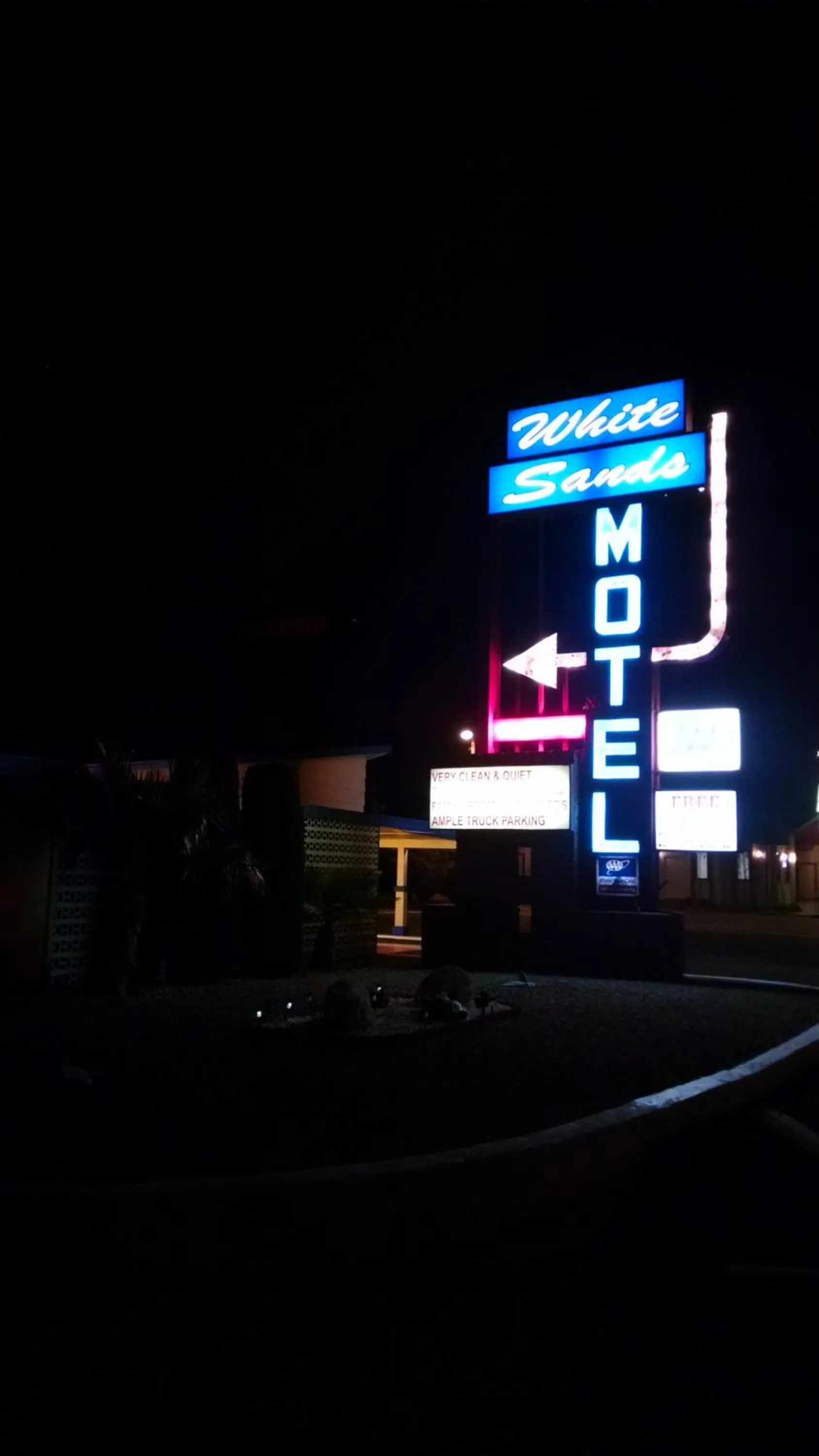 Property logo or sign in White Sands Motel