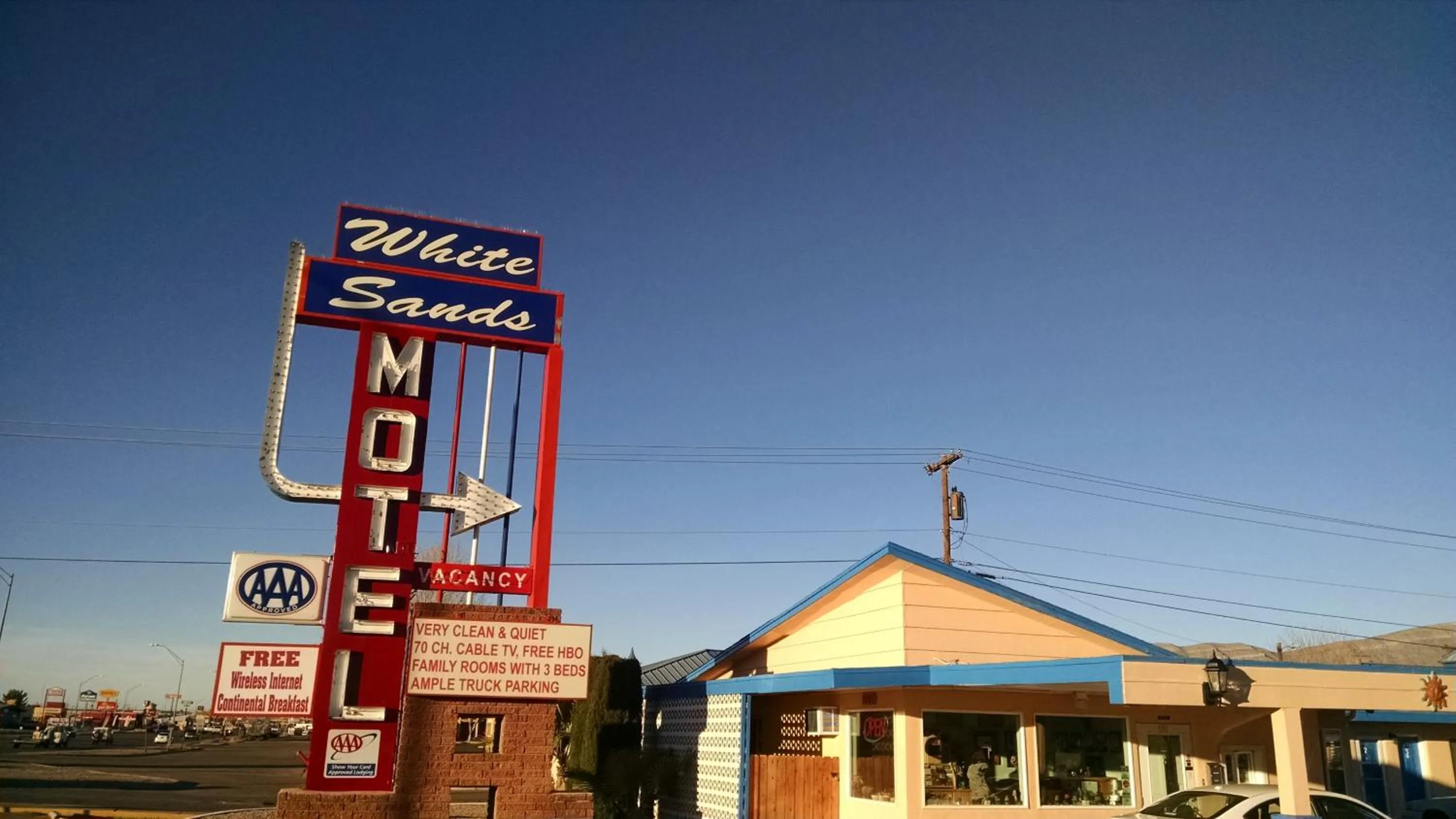 Property logo or sign in White Sands Motel