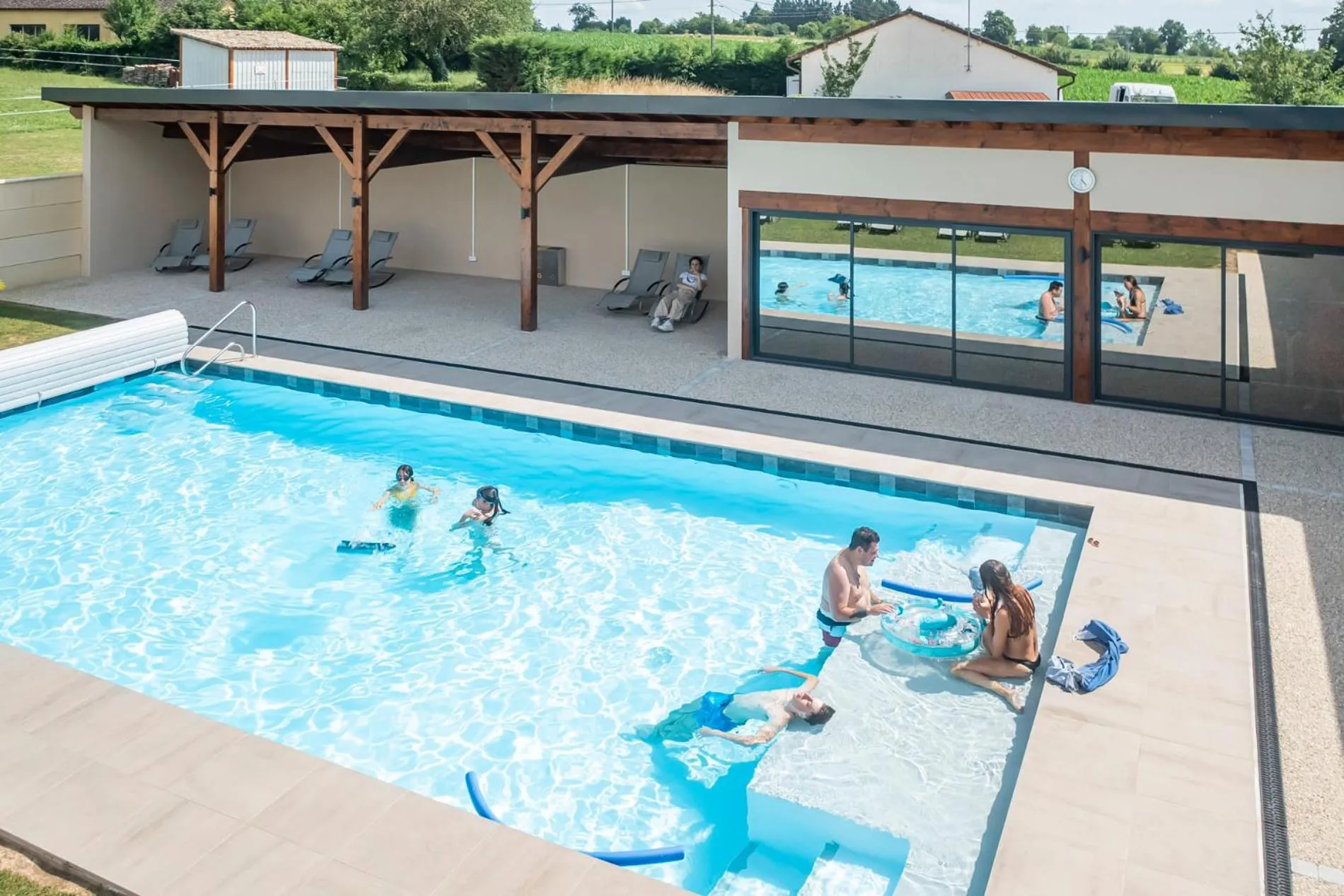 Swimming pool in Hôtel du Moulin de la Brevette