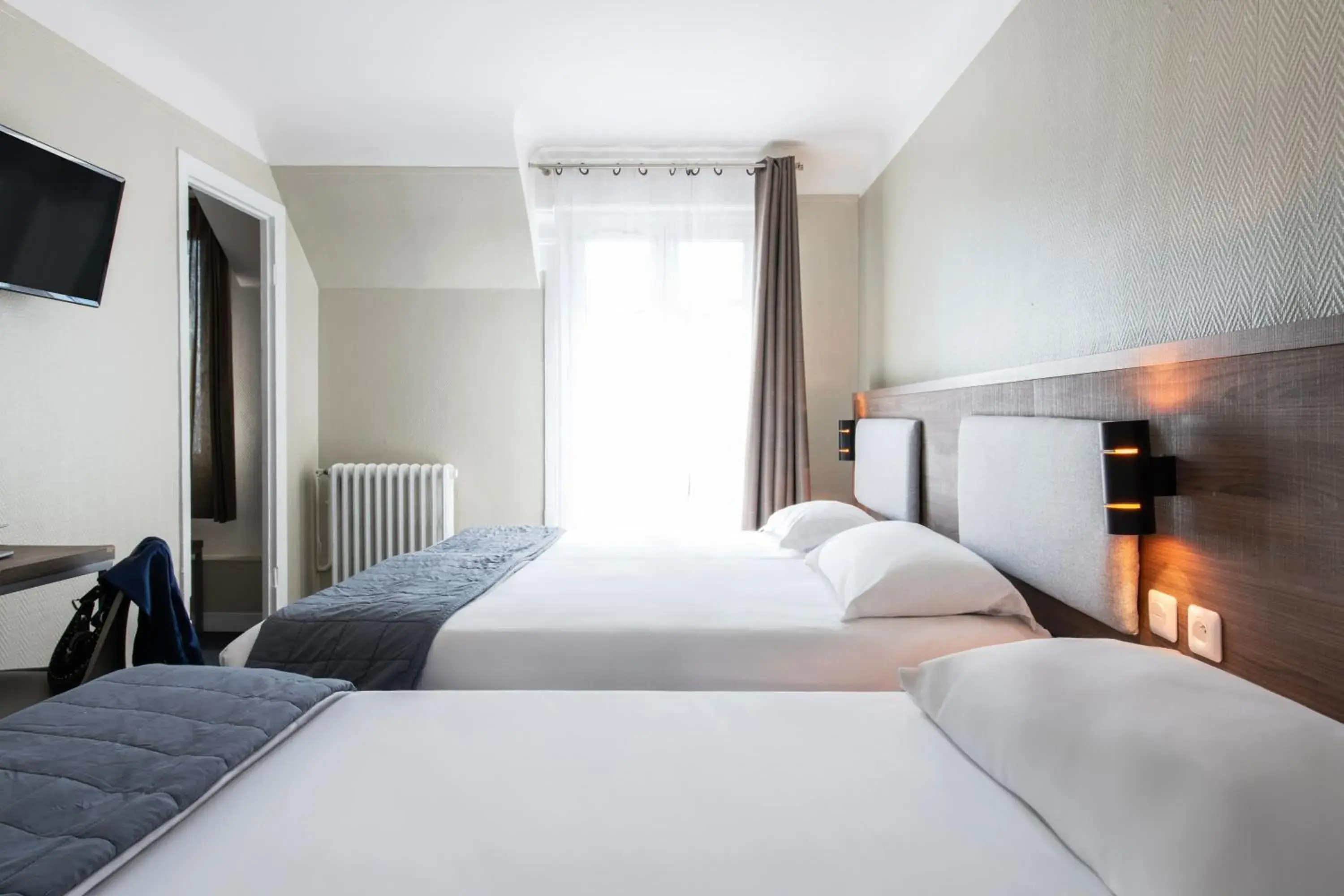 Bedroom, Bed in Hôtel Ambassadeur Bedroom, Bed in Hôtel Ambassadeur