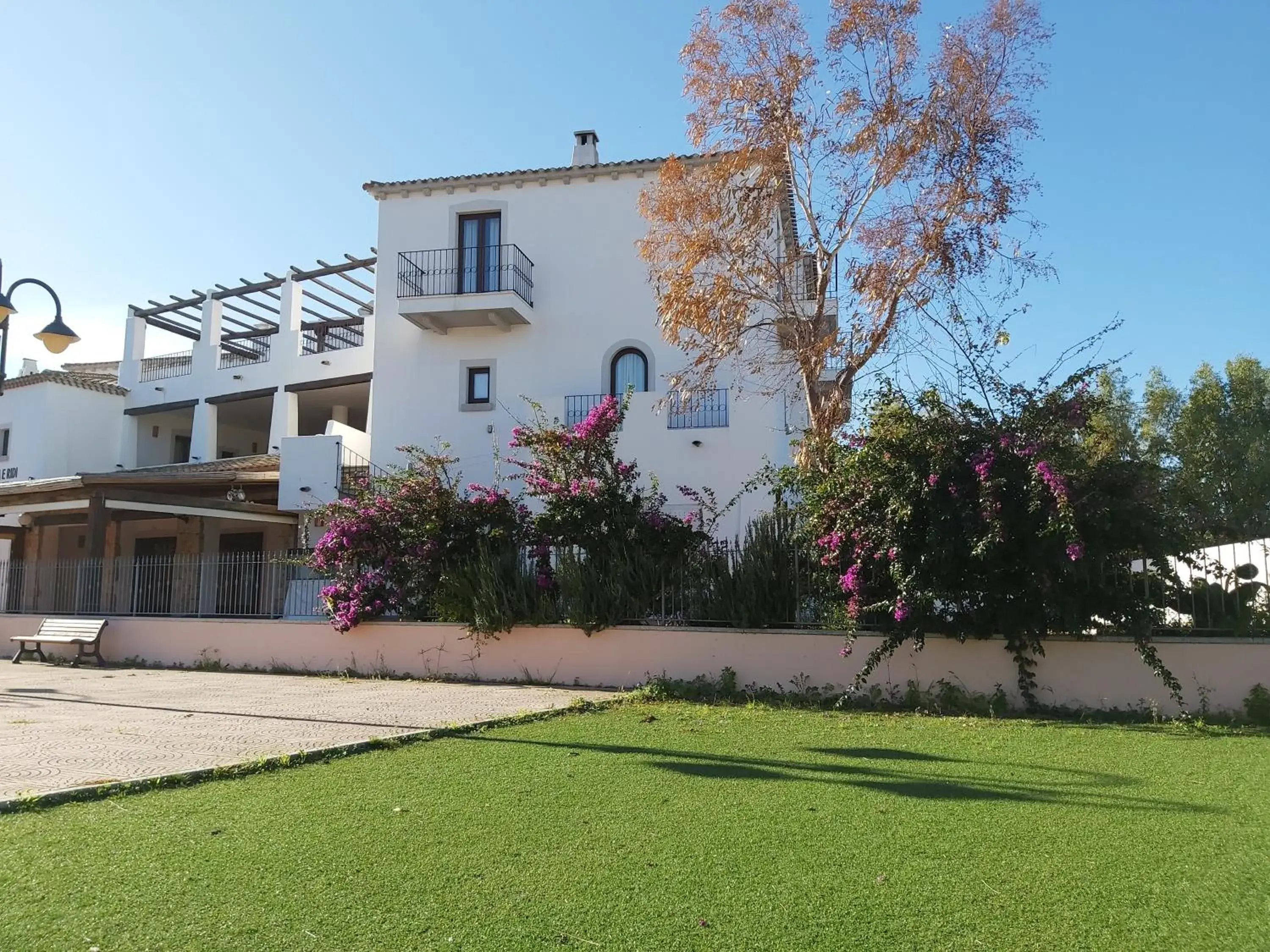 Property building in Hotel il Faro di Molara Property building in Hotel il Faro di Molara