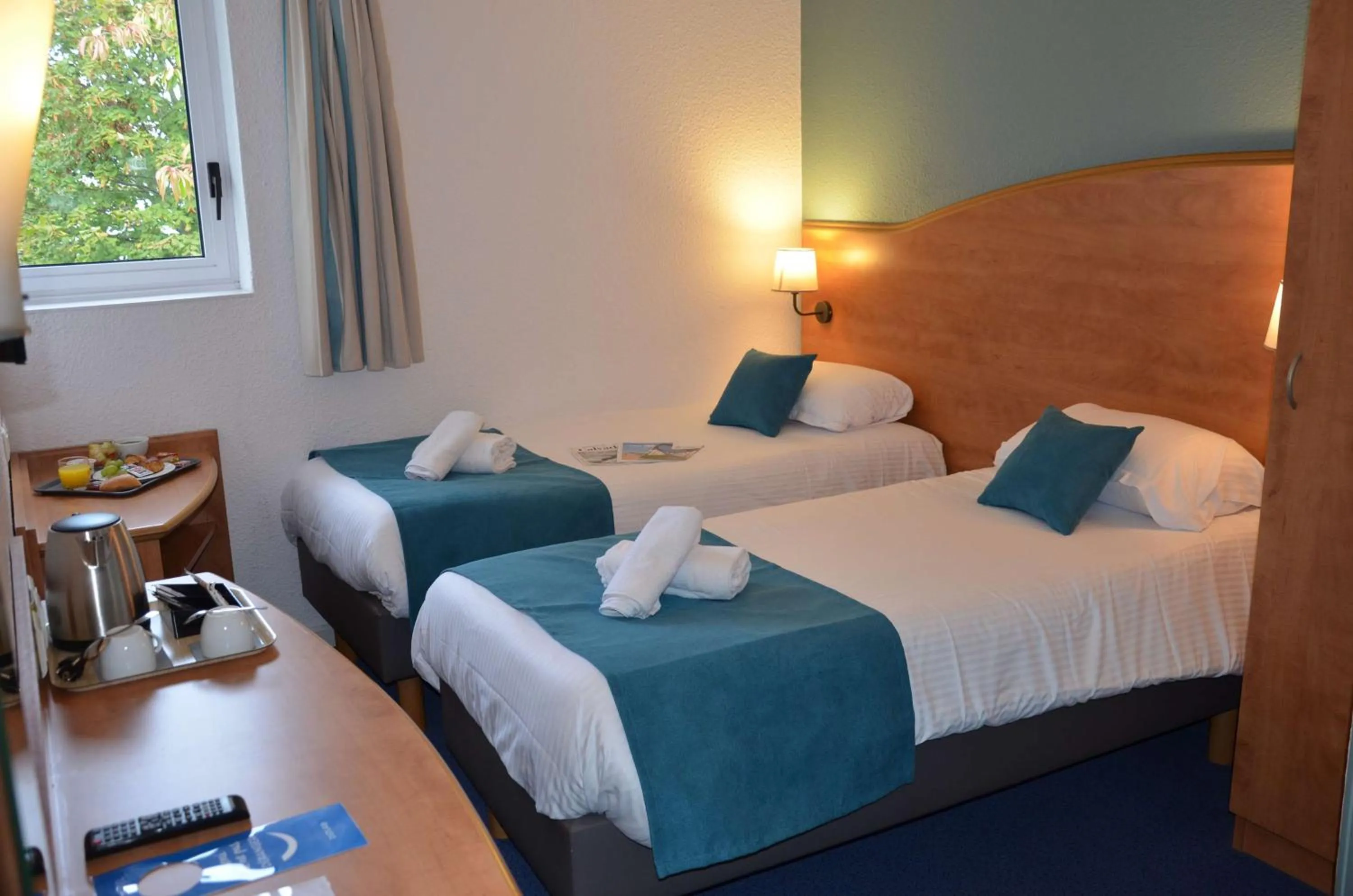 Bedroom, Bed in BRIT HOTEL Caen Hérouville