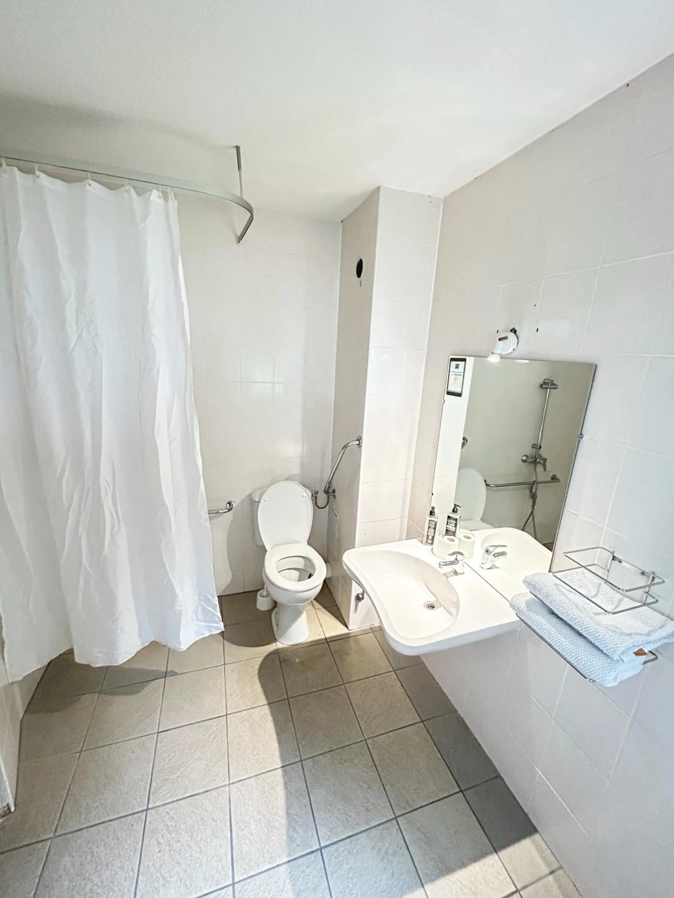 Bathroom in ibis budget Belfort Centre