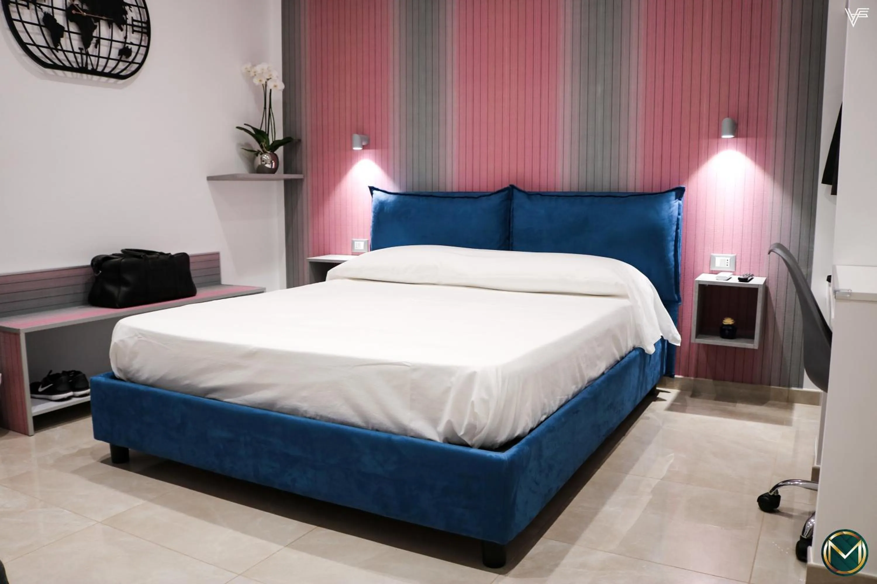 Bed in MARGHERITA BOUTIQUE ROOMS