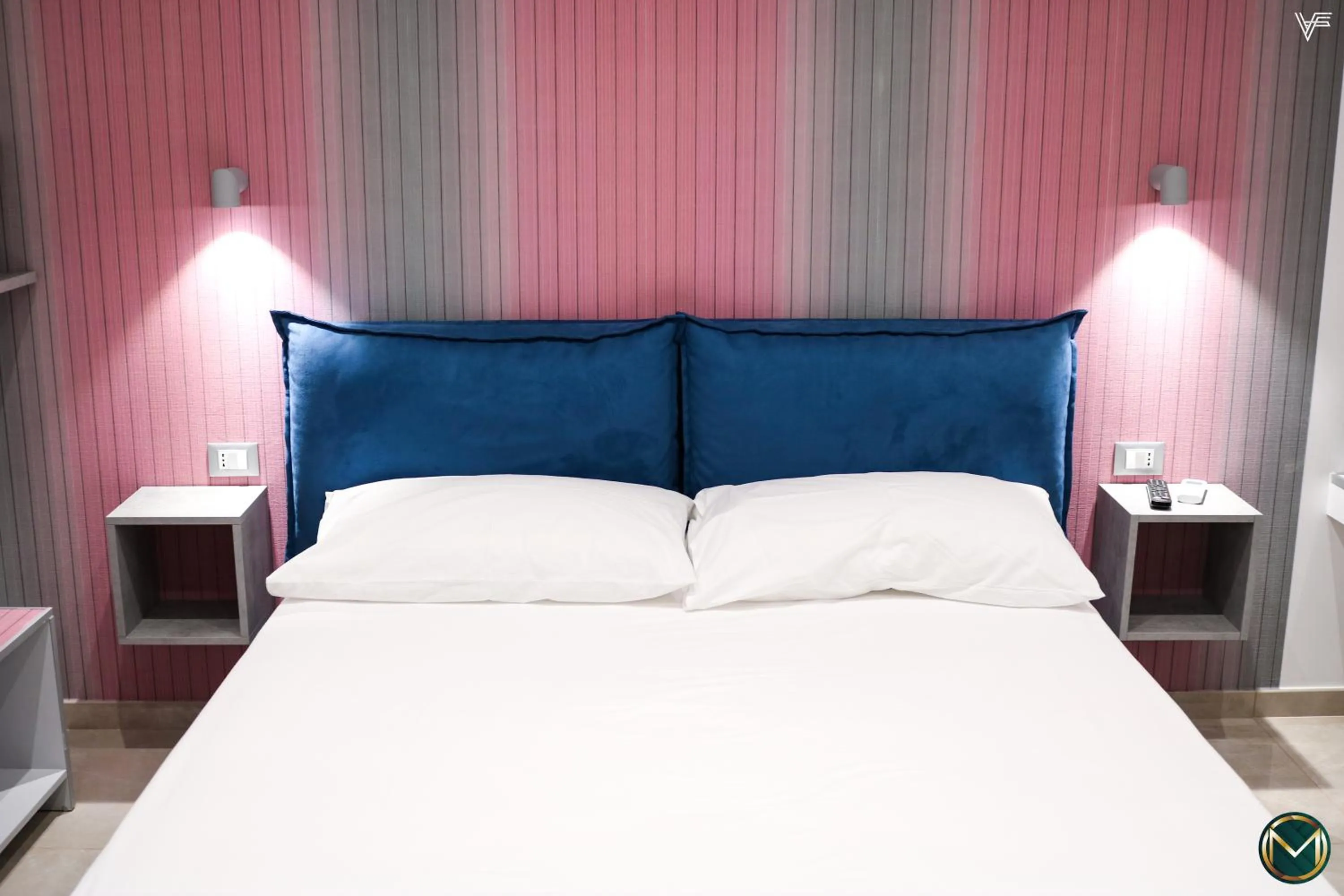 Bed in MARGHERITA BOUTIQUE ROOMS