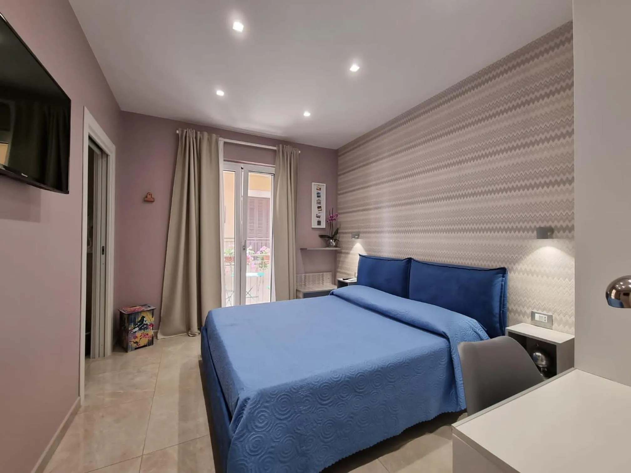 Bed in MARGHERITA BOUTIQUE ROOMS