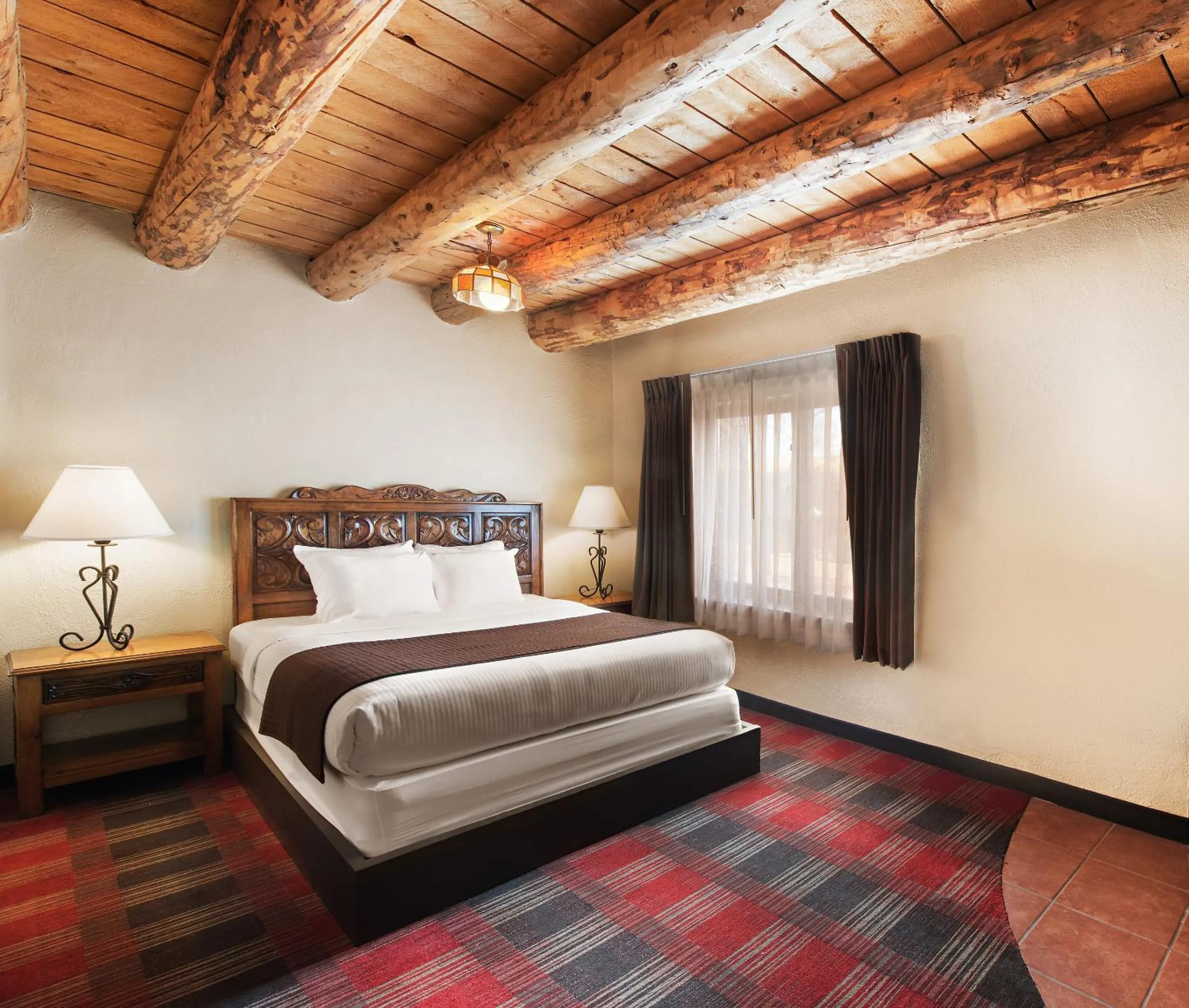 Bed in Sagebrush Inn & Suites