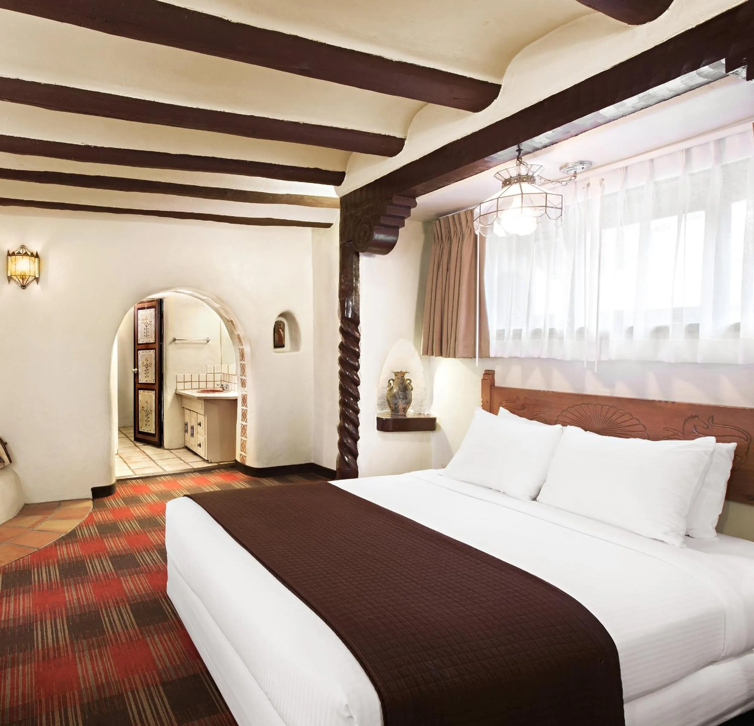 Bed in Sagebrush Inn & Suites