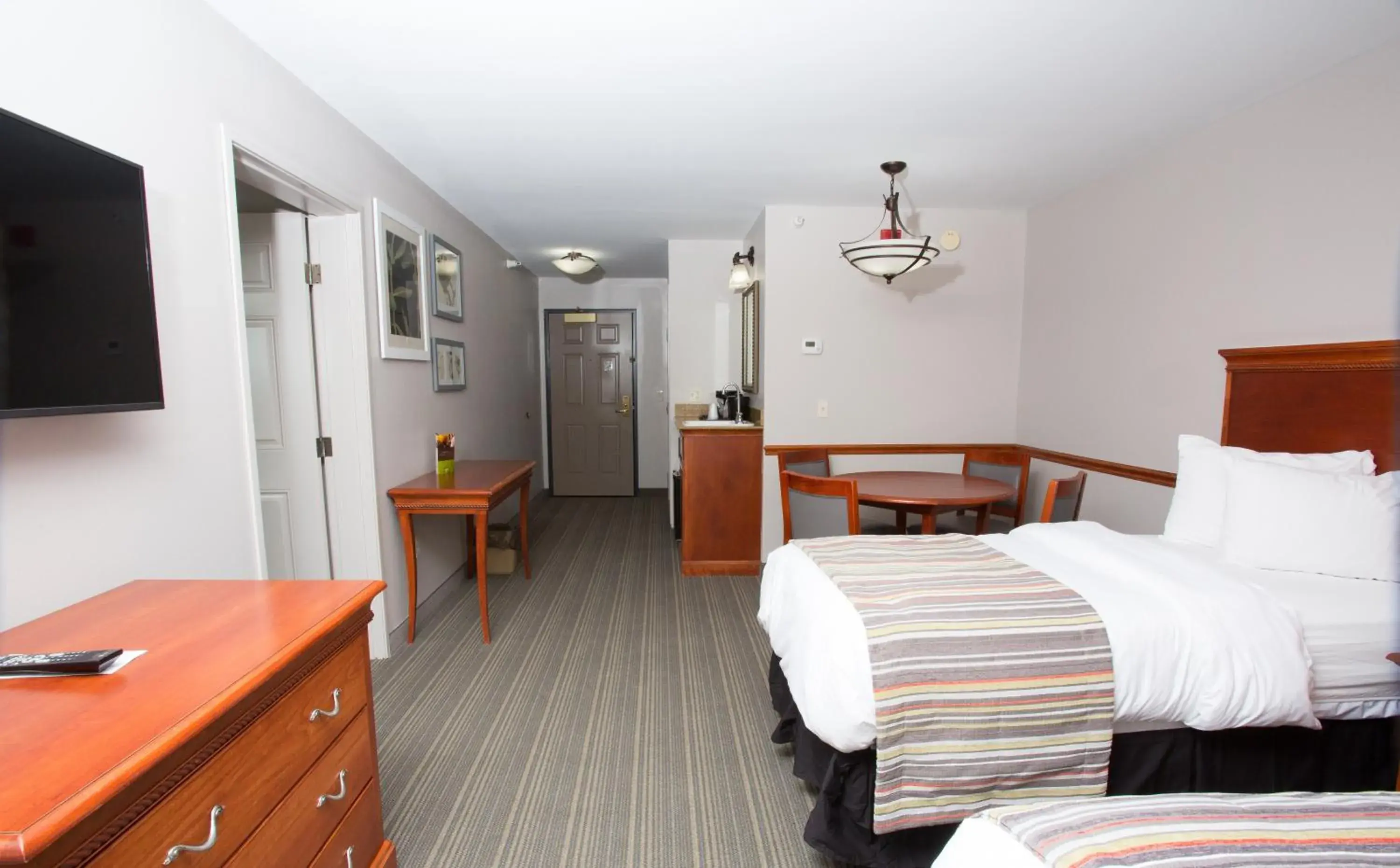 Extended Stay King Suite with One King bed and Two Single Beds - Non-Smoking in Country Inn & Suites by Radisson, Grand Forks, ND Extended Stay King Suite with One King bed and Two Single Beds - Non-Smoking in Country Inn & Suites by Radisson, Grand Forks, ND