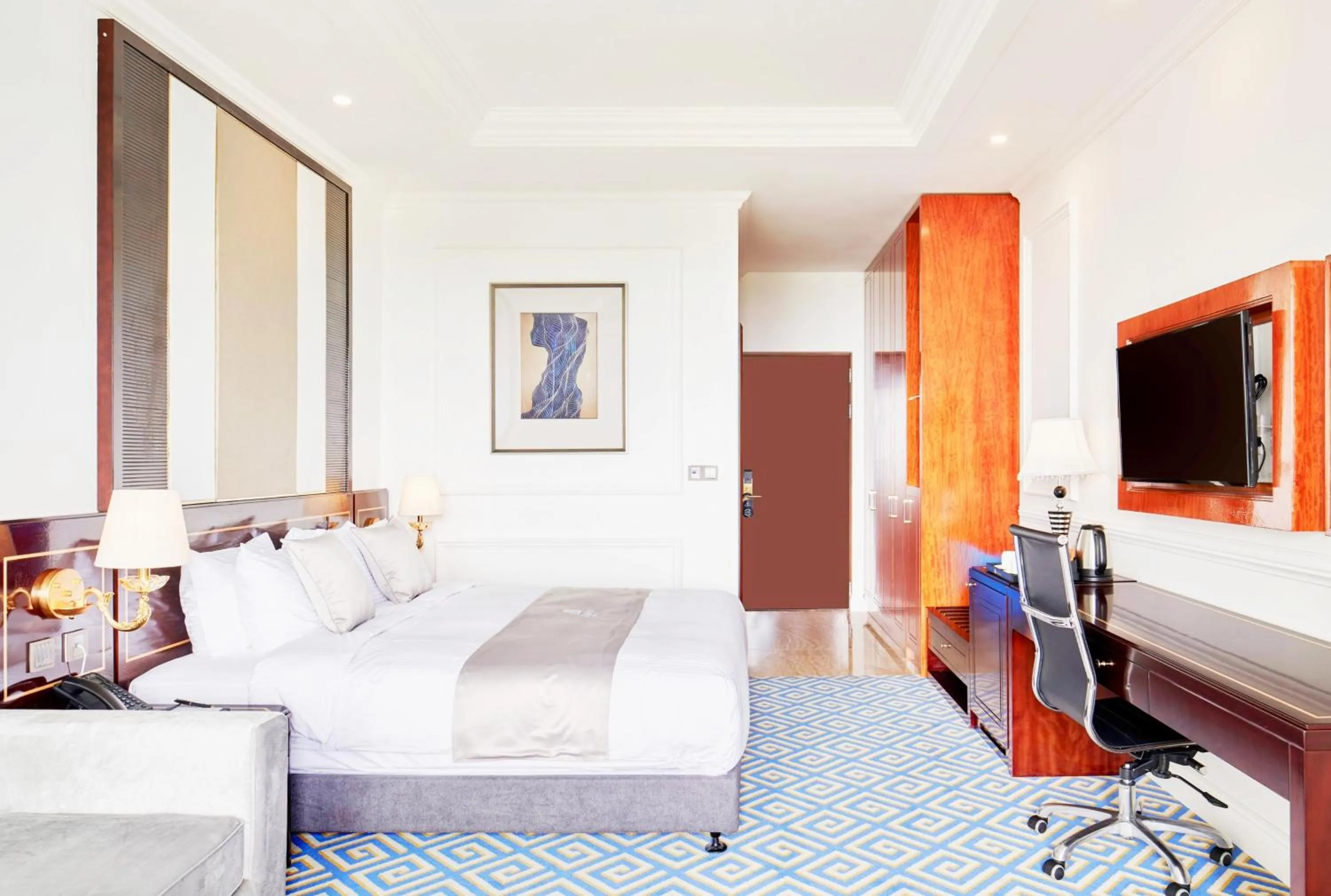 Bed in GoldOne Hotel & Suites