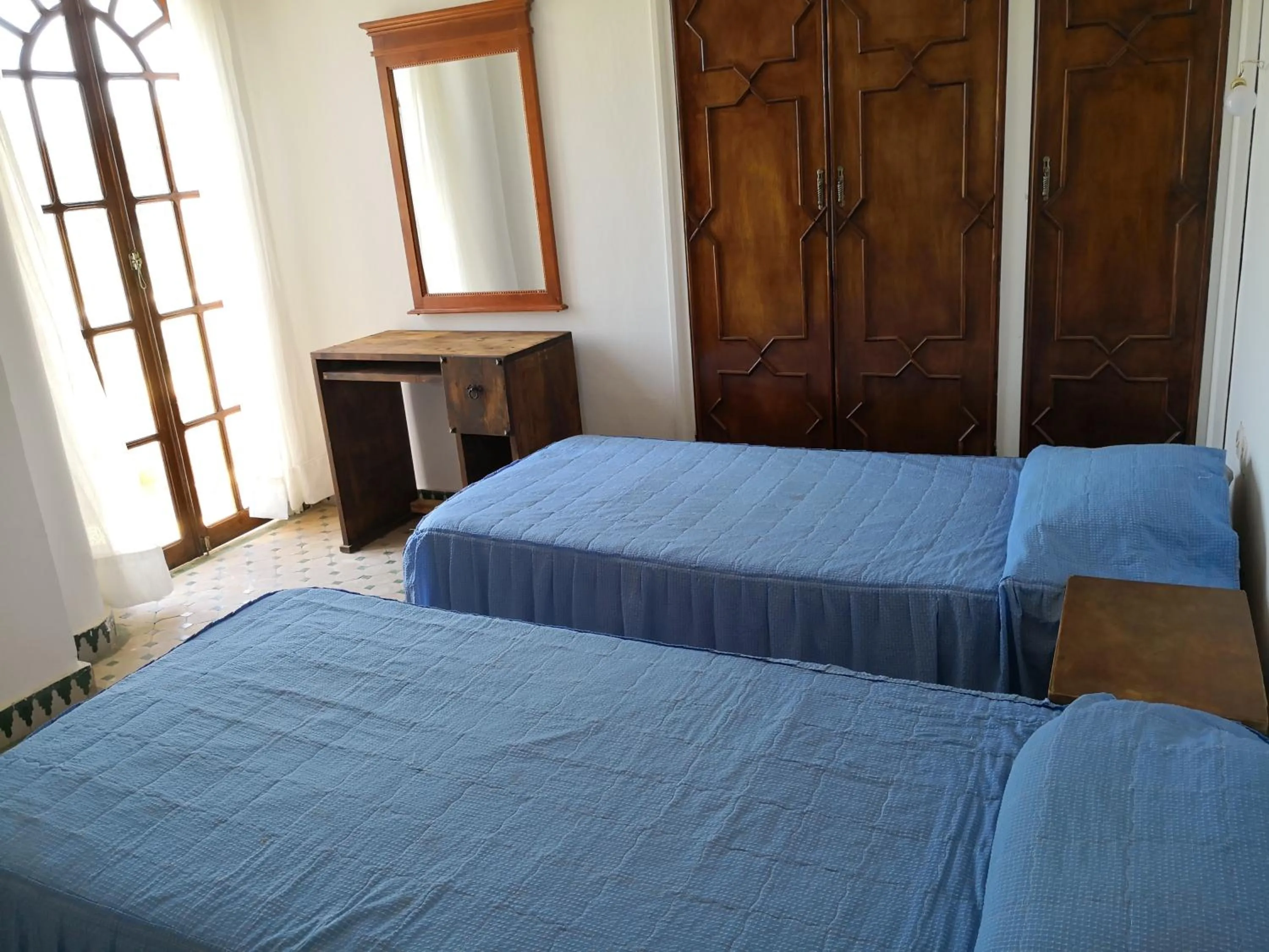 Bed in RIAD DES OISEAUX