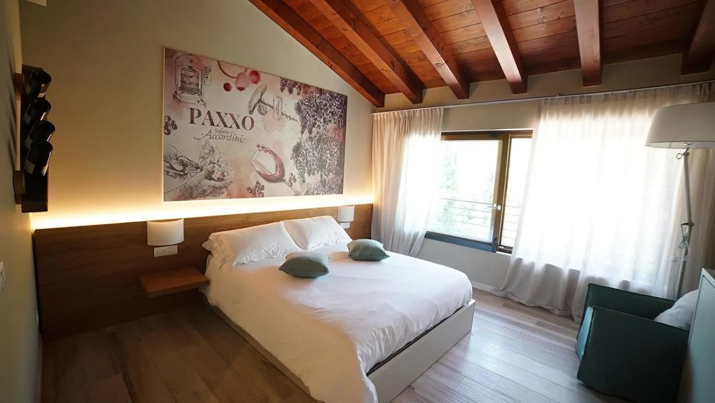 Bed in AGRITURISMO ACINATICO WINE RELAIS