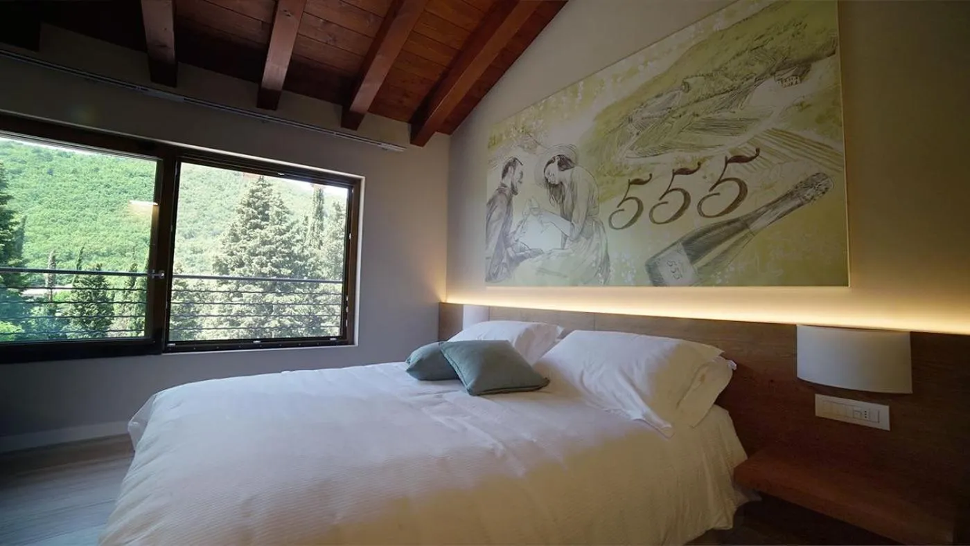 Bed in AGRITURISMO ACINATICO WINE RELAIS