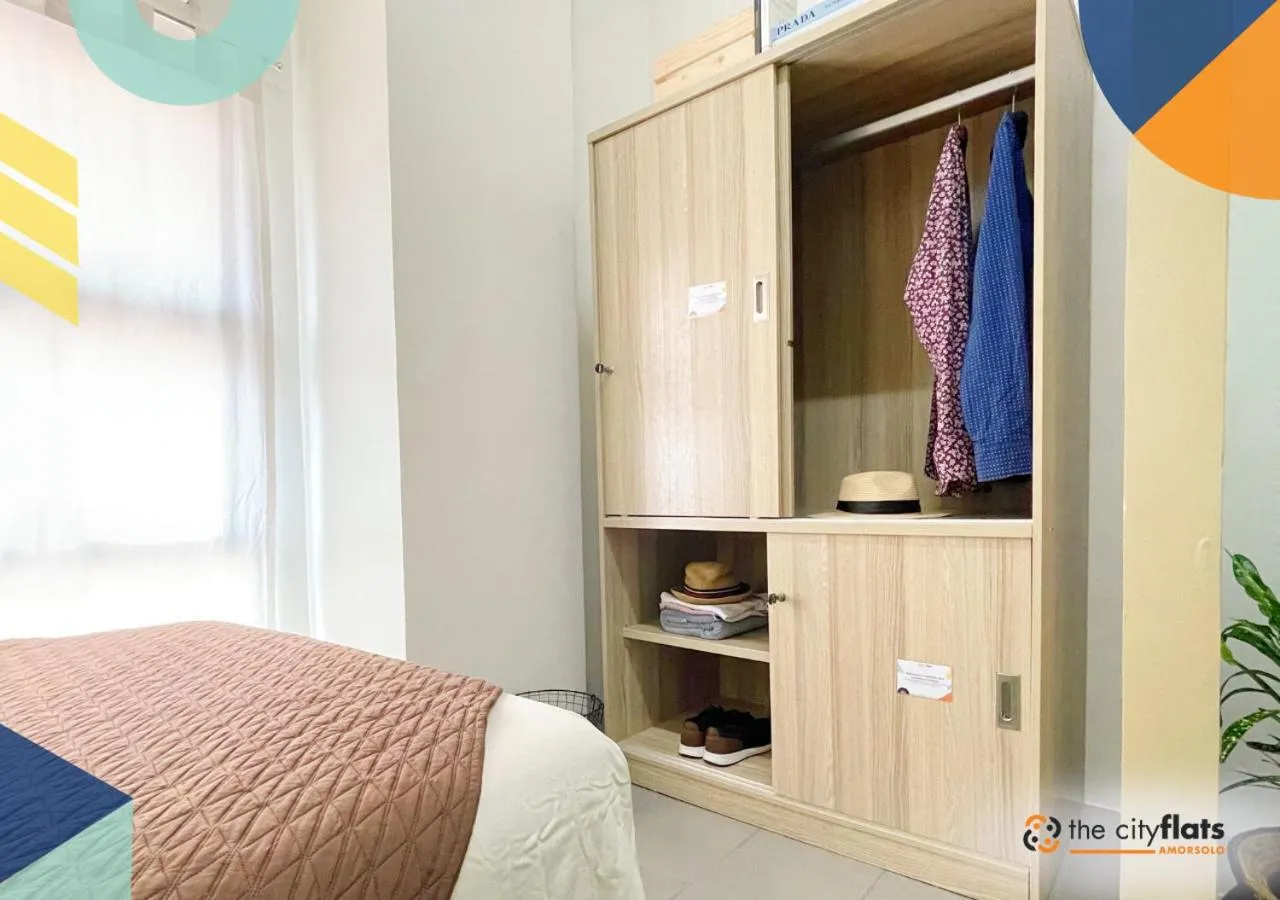 wardrobe, Bed in The City Flats Amorsolo