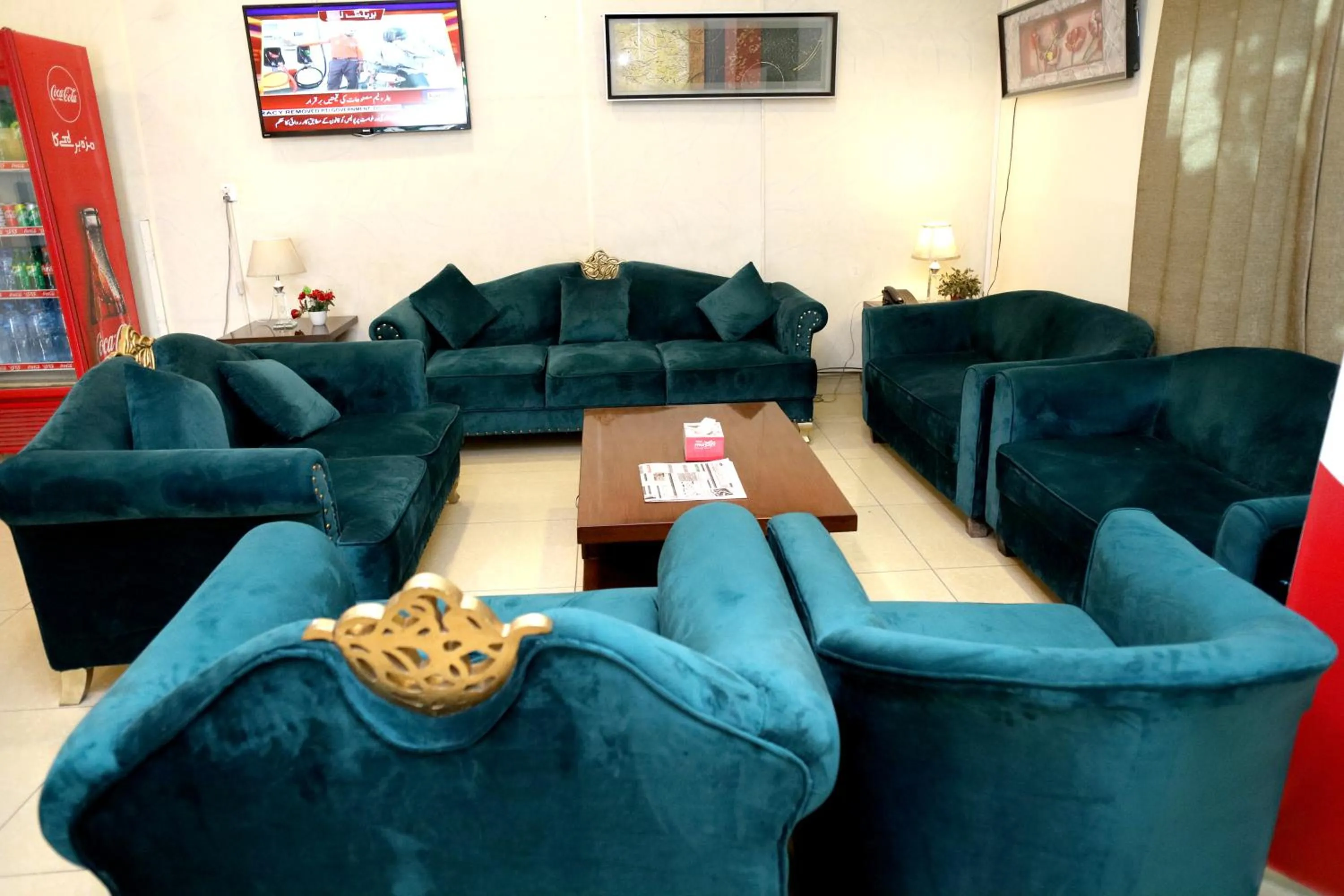 Communal lounge/ TV room in Royalton Inn Hotel - Gulberg