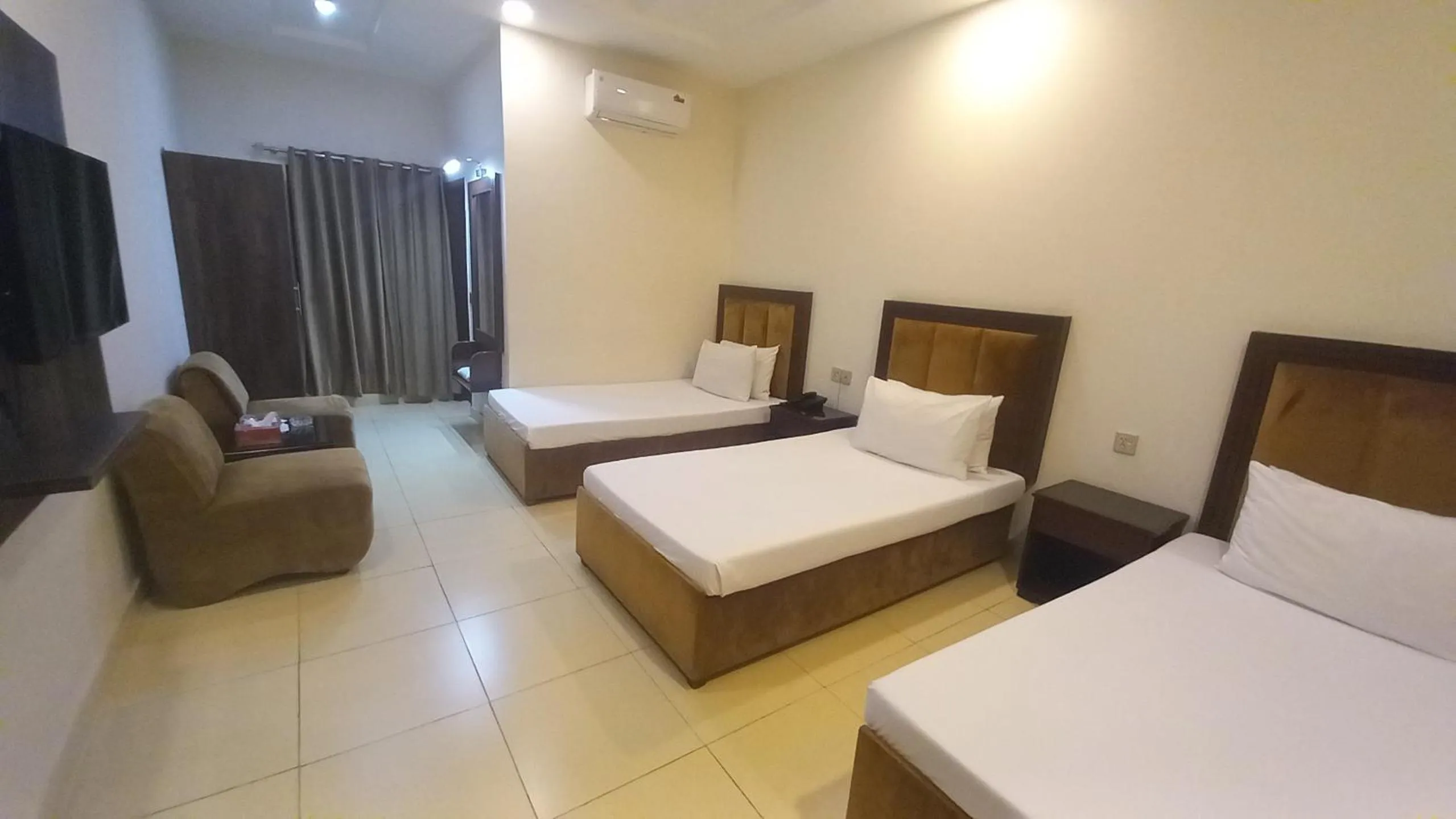 Photo of the whole room, Bed in Royalton Inn Hotel - Gulberg
