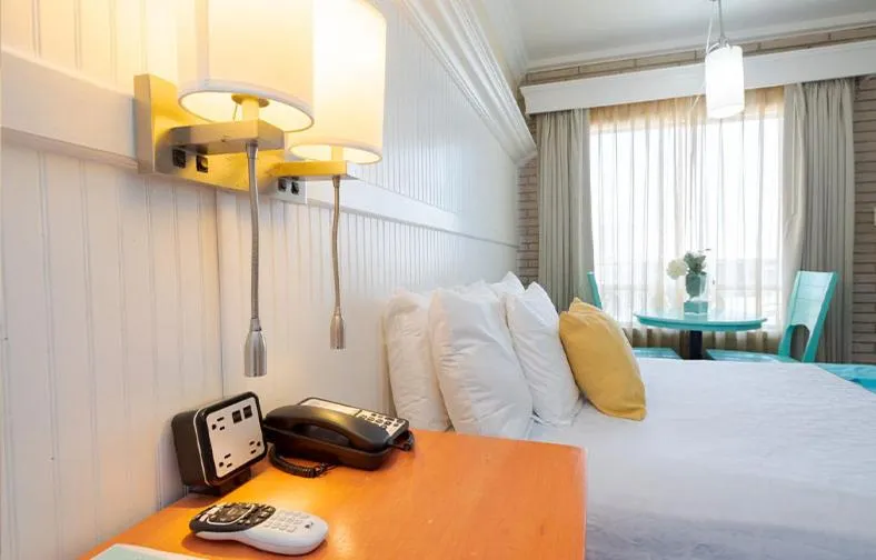 Bed in Gaido's Seaside Inn