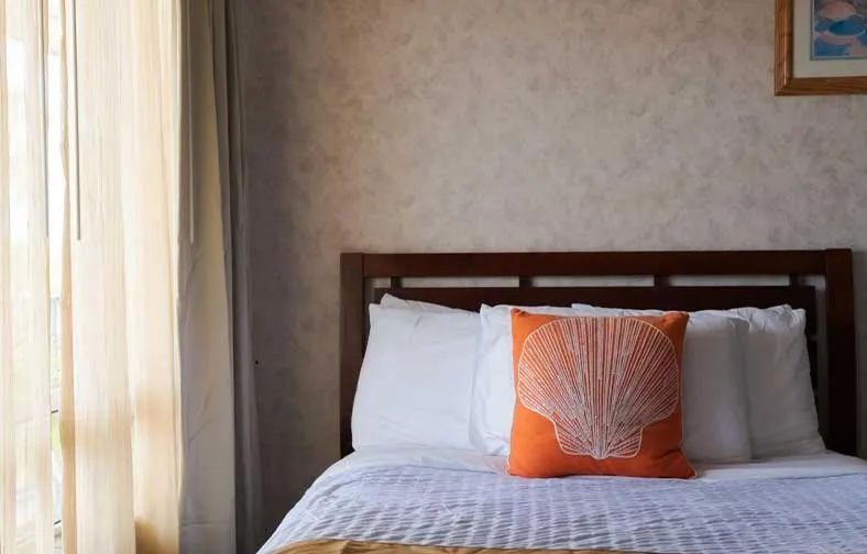 Bed in Gaido's Seaside Inn