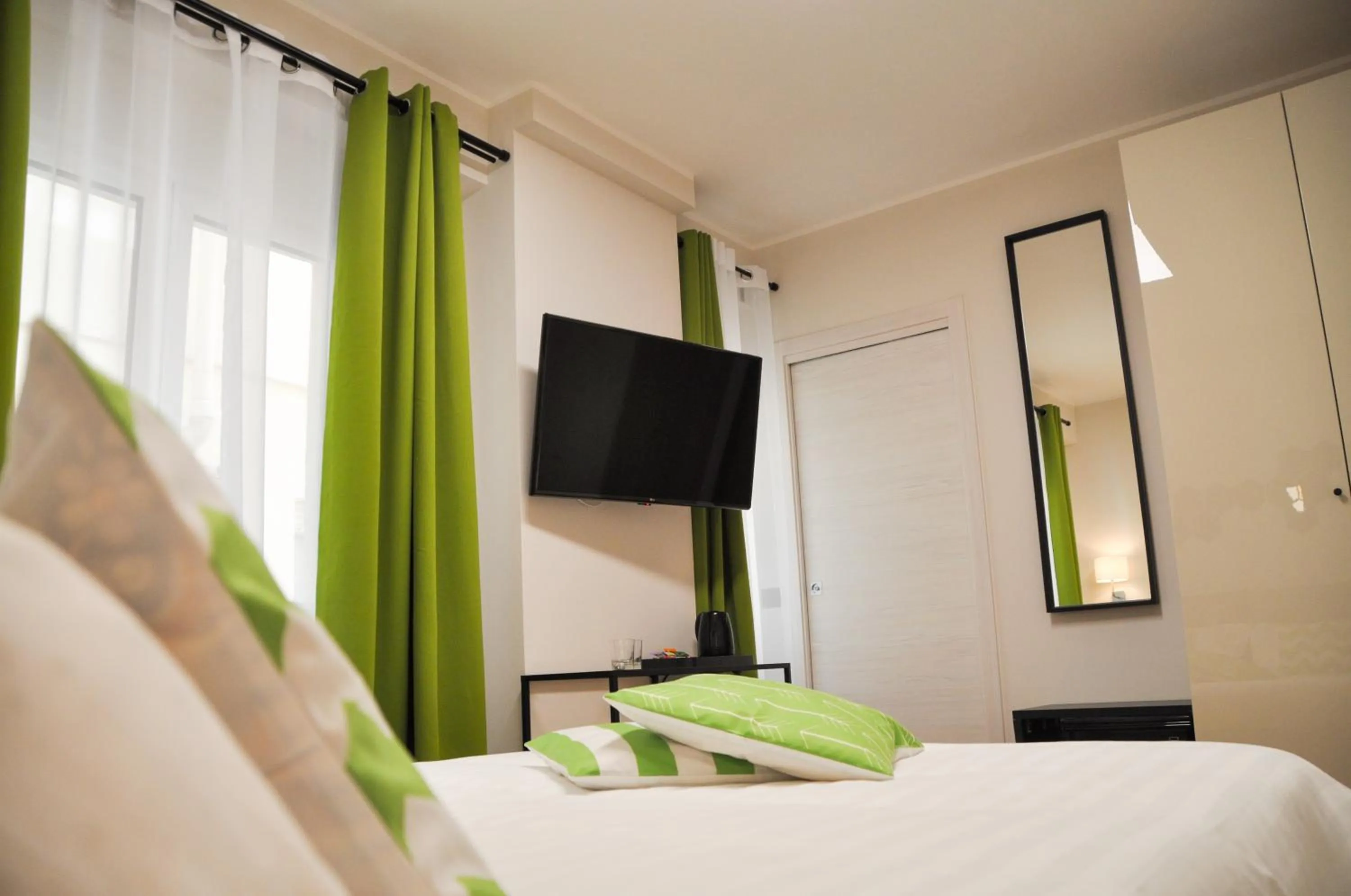 Bed in EVA LUXURY ROOMS CAGLIARI