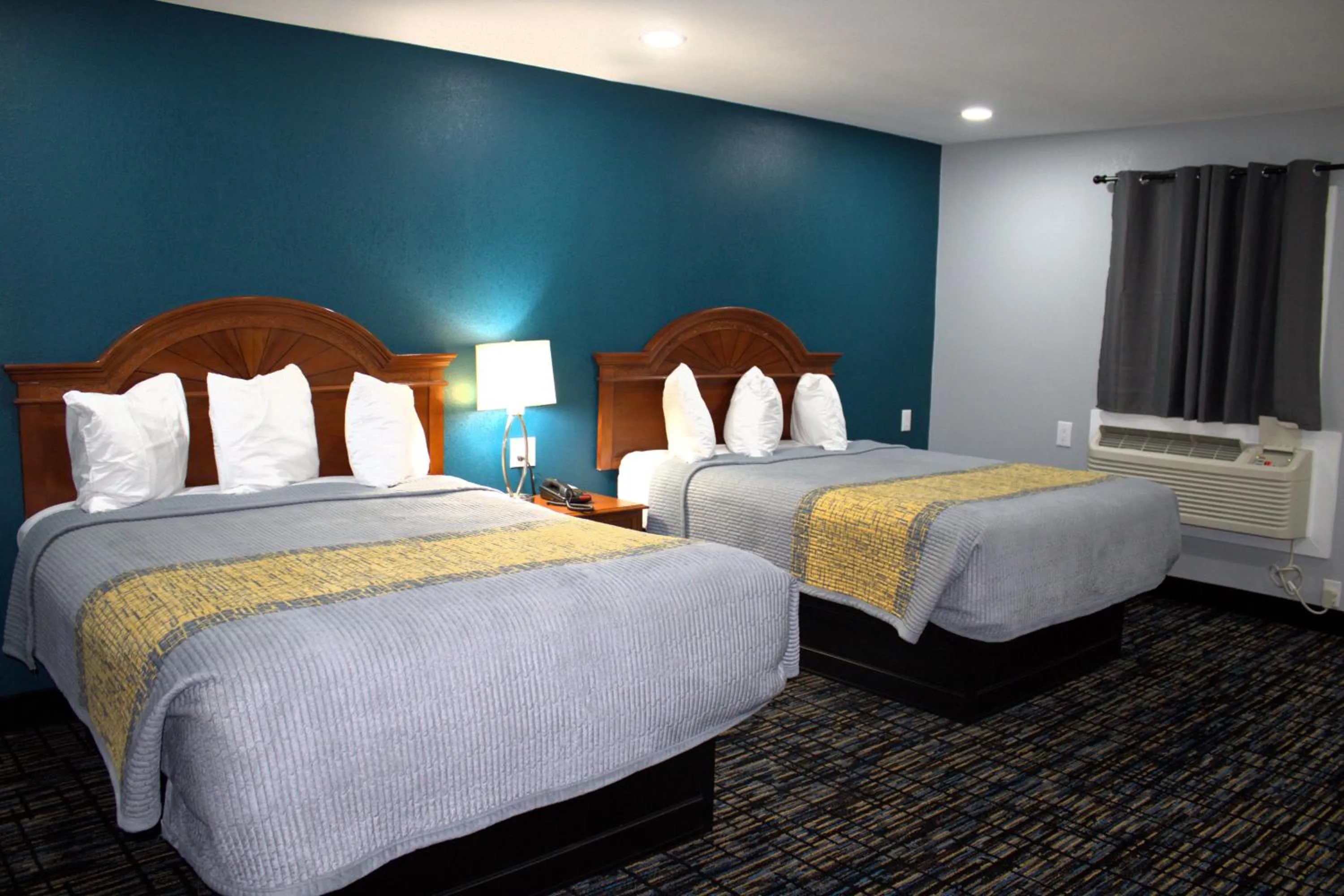 Bed in HavenPointe Inn & Suites