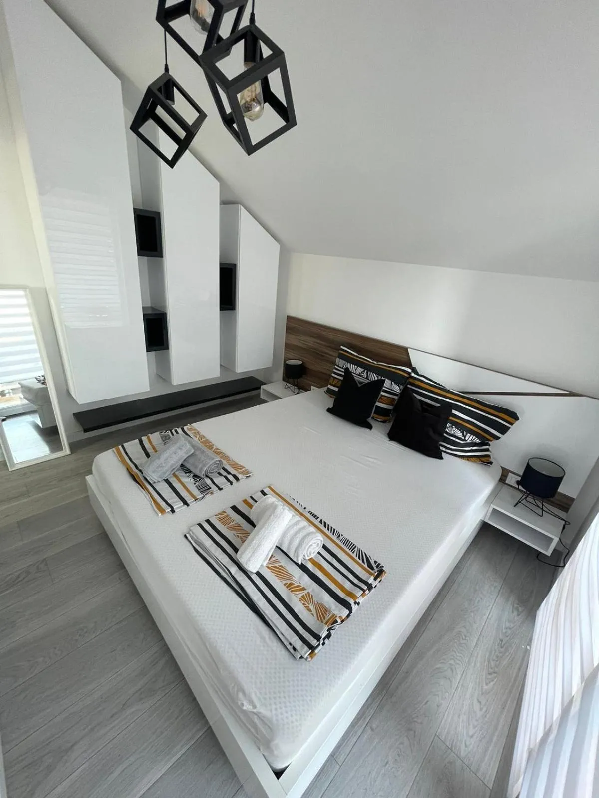 Bed in Apartments Mak & Lux - sea & sunset top view