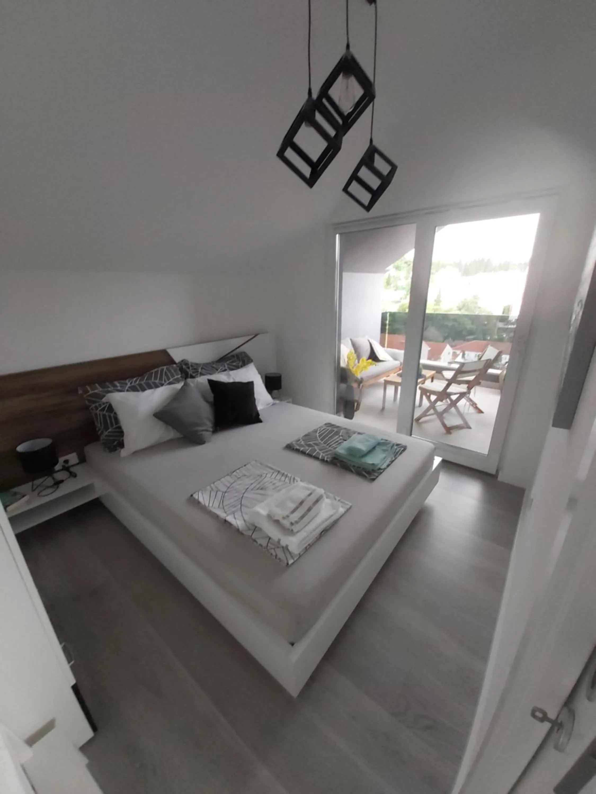 Bed in Apartments Mak & Lux - sea & sunset top view