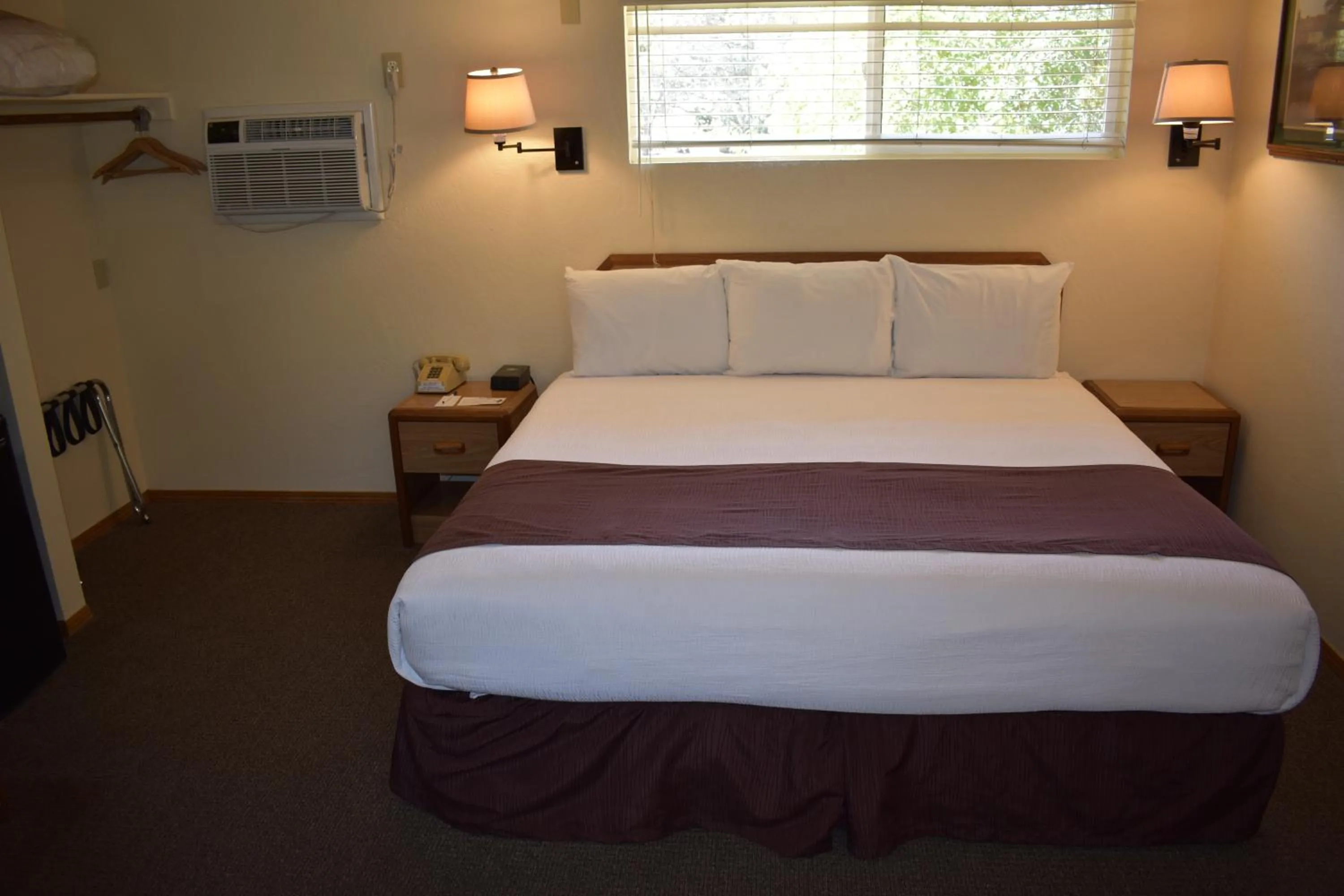 Bed in Lazy J Ranch Motel