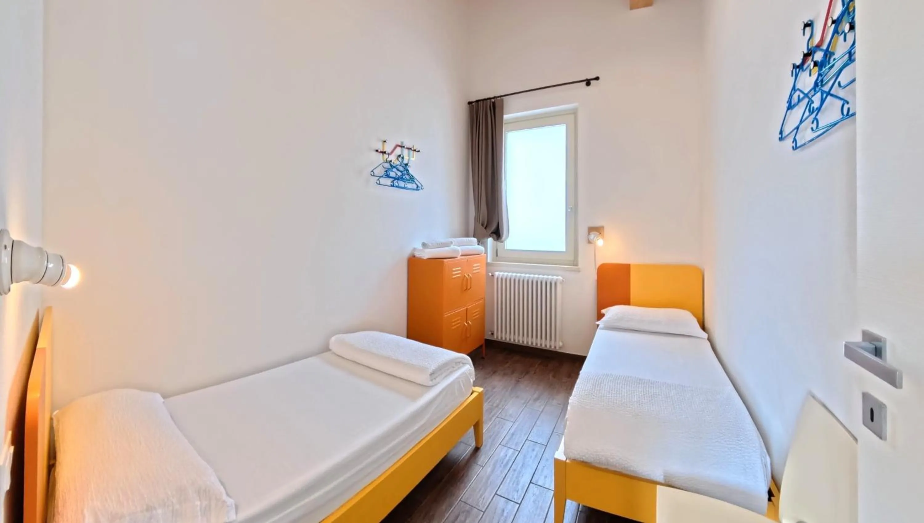 Bed in Oasi Da Vinci Apartments Lake Garda View