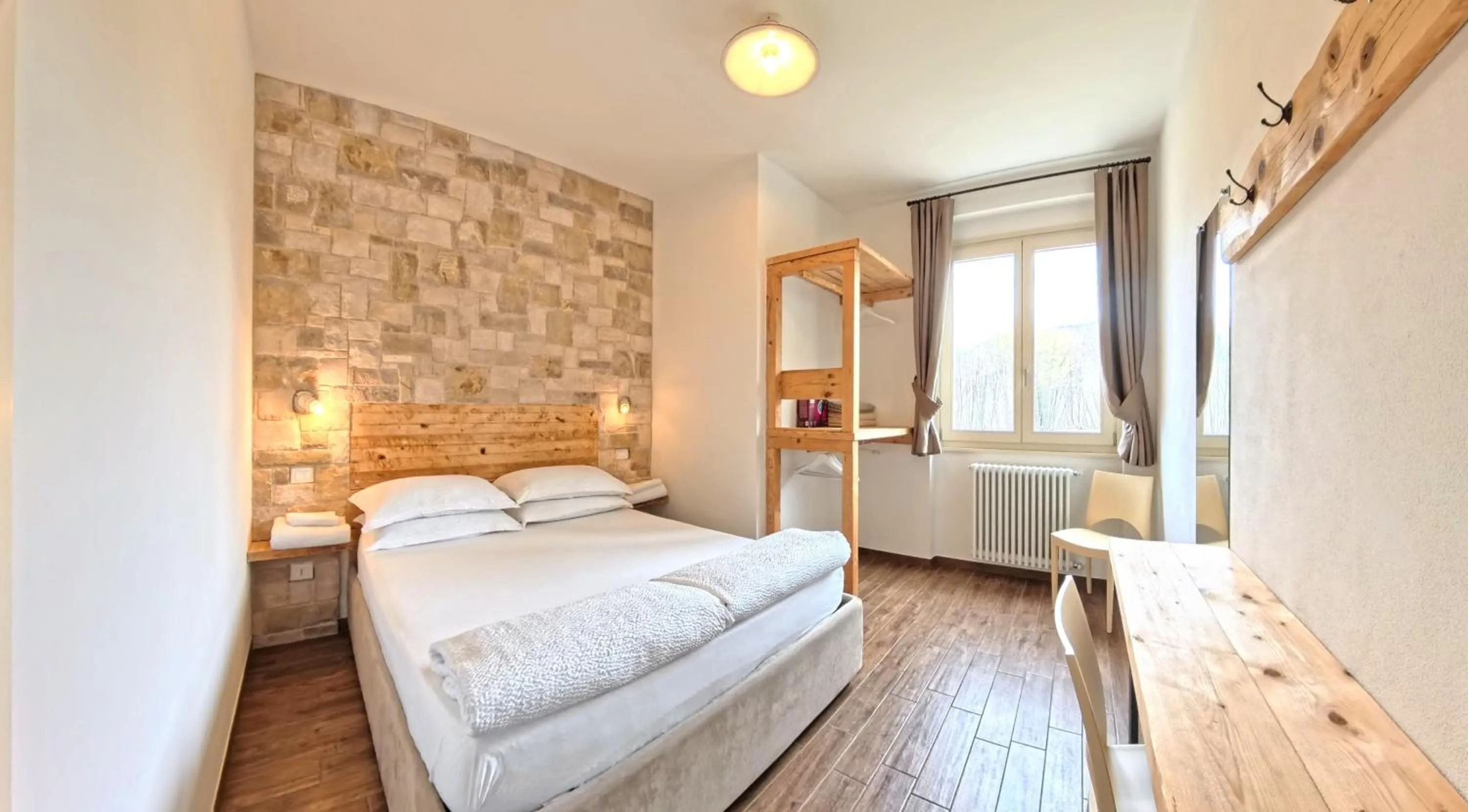 Bed in Oasi Da Vinci Apartments Lake Garda View