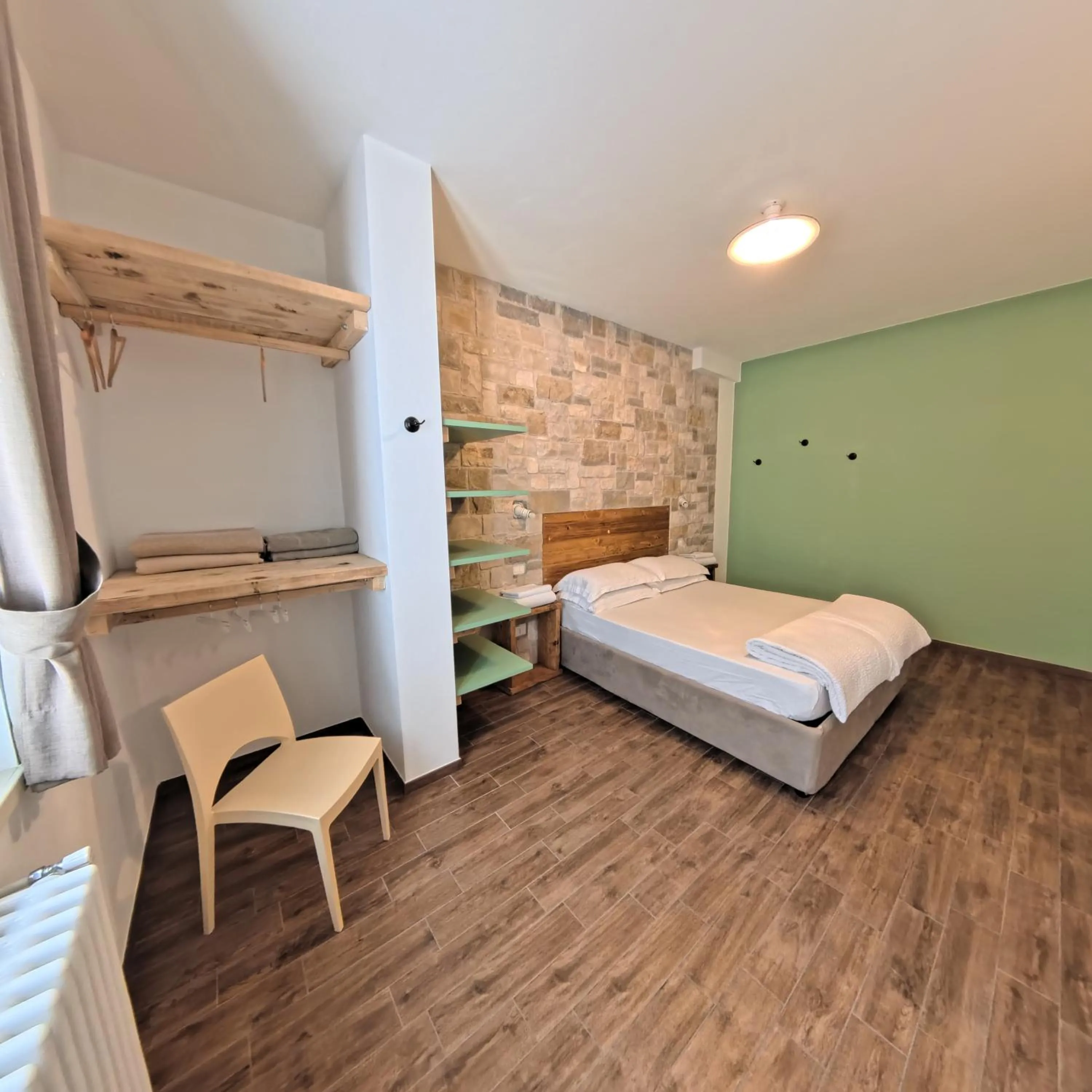 Bed in Oasi Da Vinci Apartments Lake Garda View