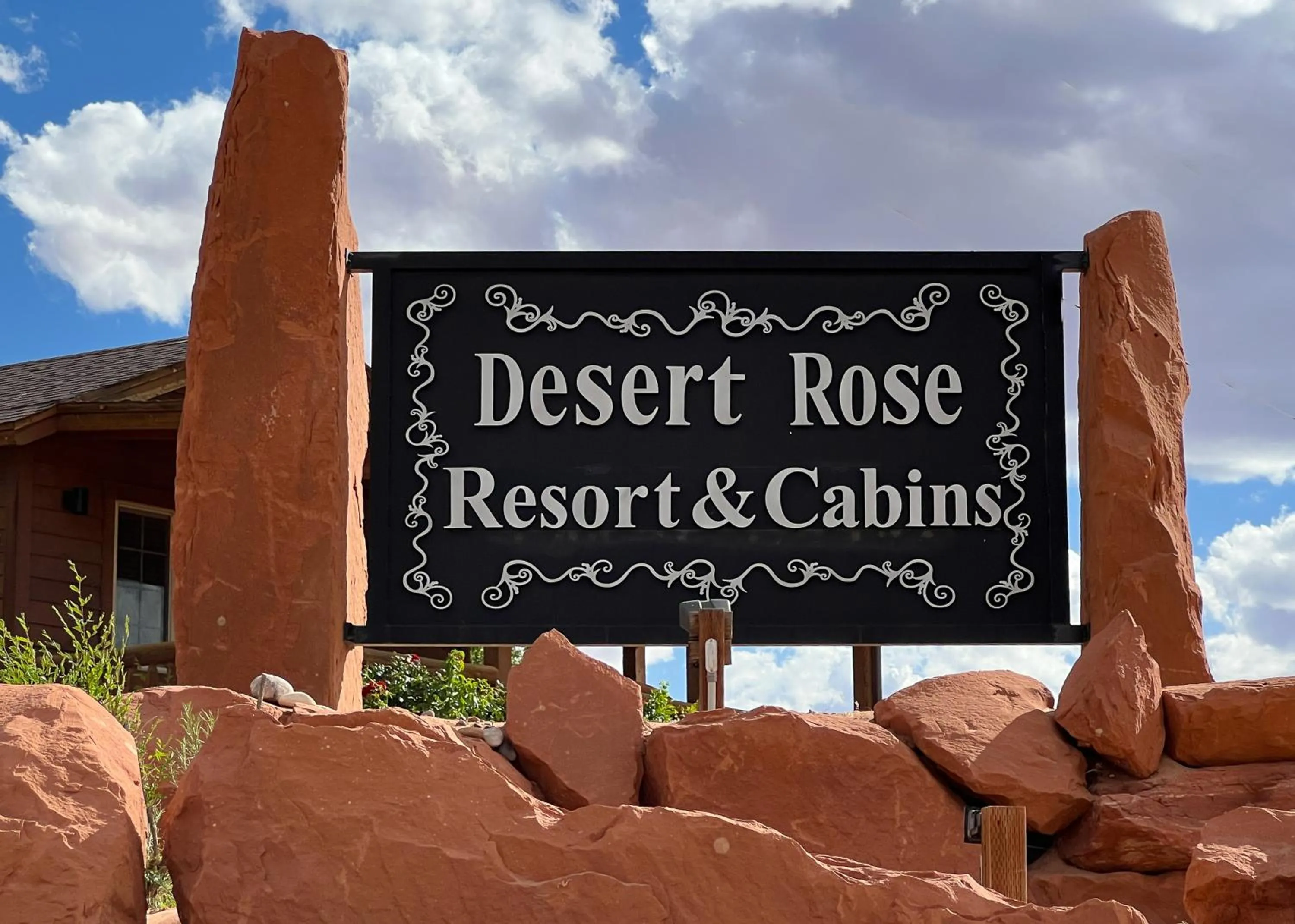 Property logo or sign in Desert Rose Resort & Cabins