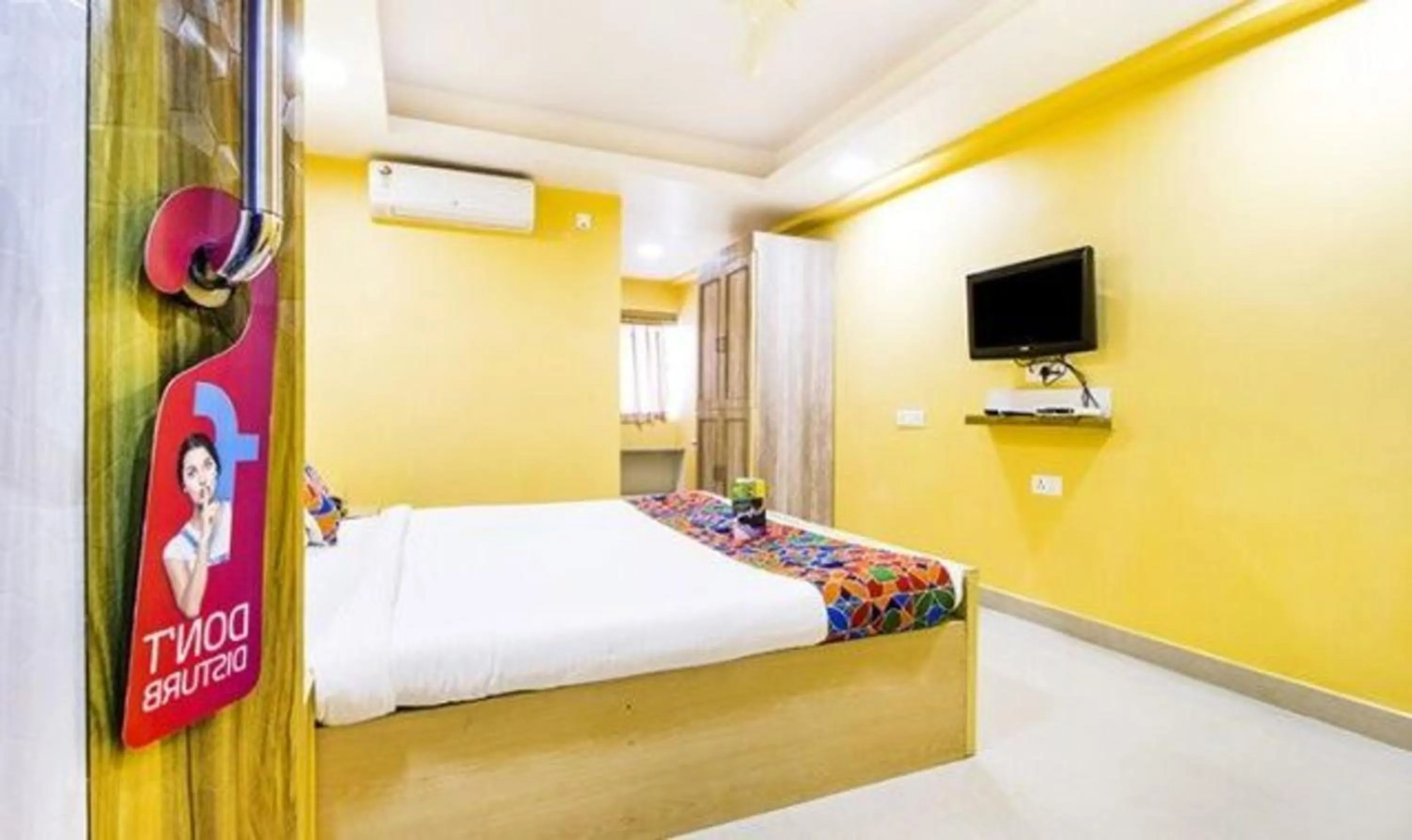 Bed in FabHotel Amaltas