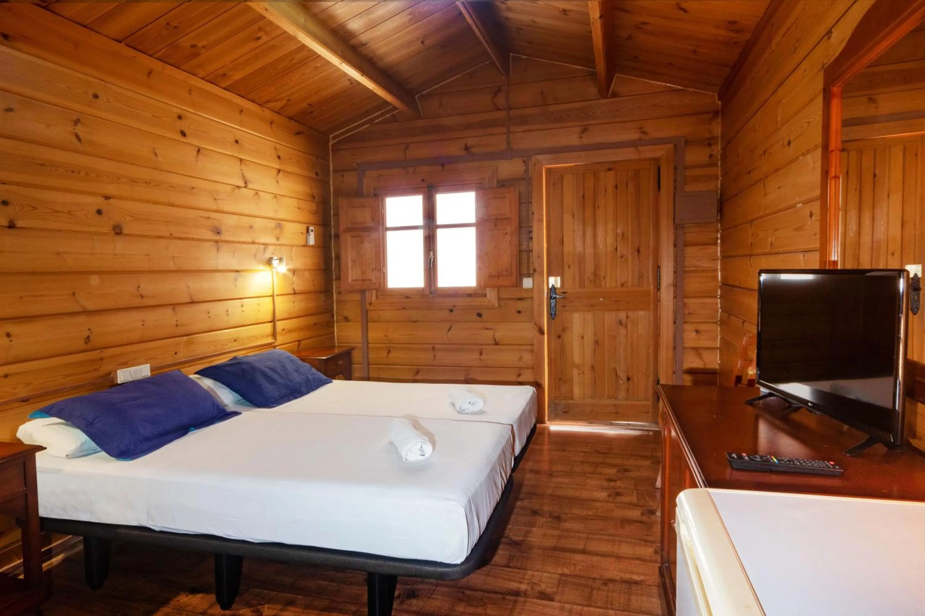 Bed in APARTAMENTOS PALASIET